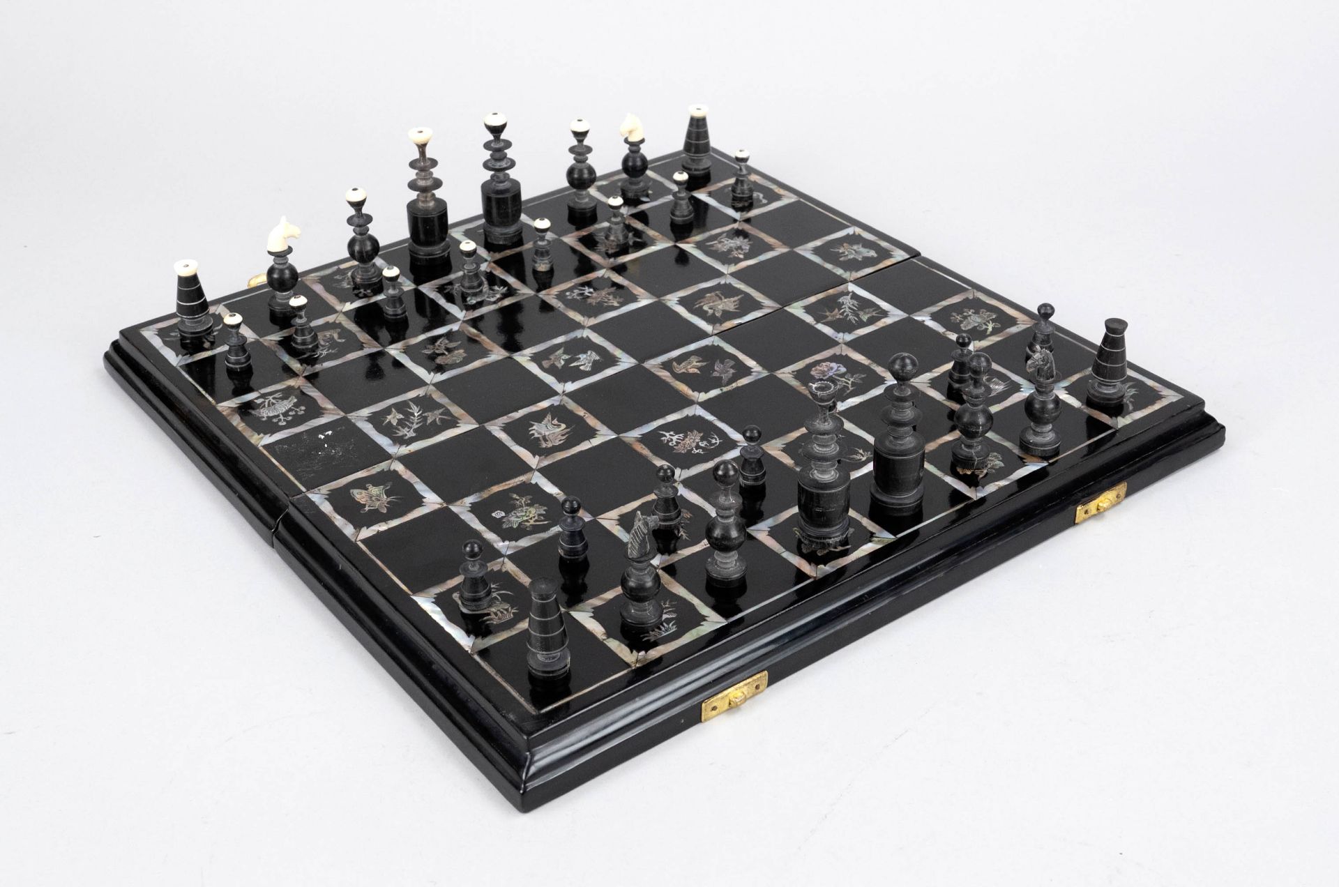 Chess set in lacquer box, China, 20th century, wood with black lacquer and mother-of-pearl inlays of