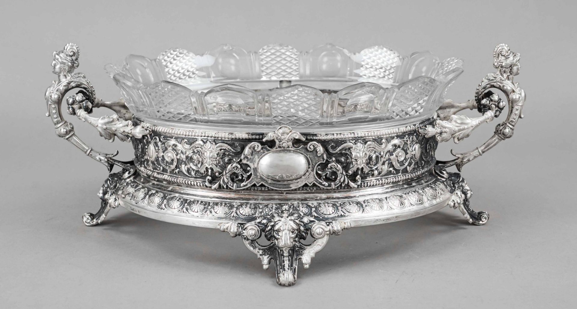 Historism jardiniere, end of 19th c., silver tested, on 4 decorated feet, straight wall, figural