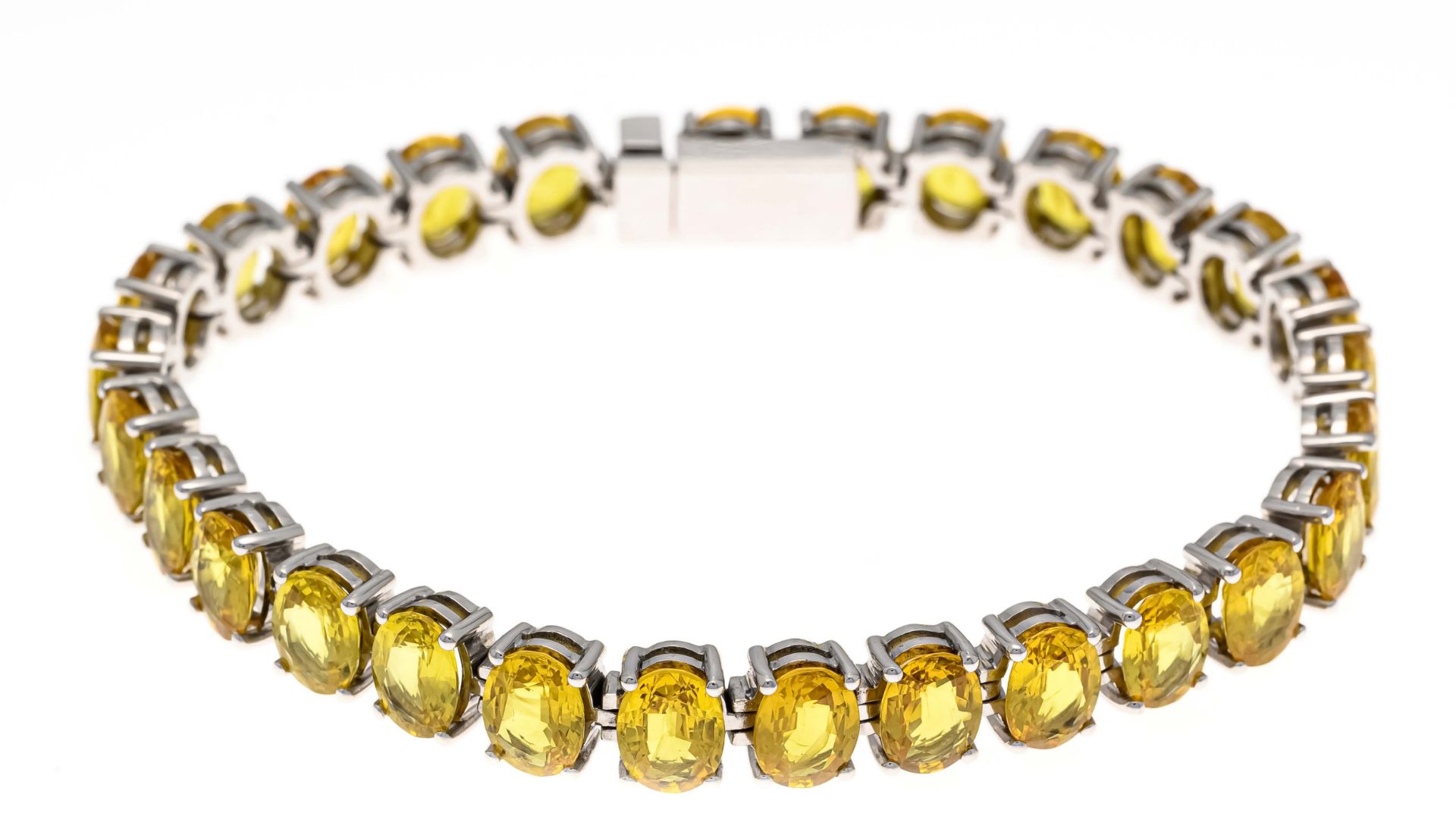 sapphire bracelet WG 750/000 with 28 oval faceted sapphires, together approx. 33,6 ct in bright