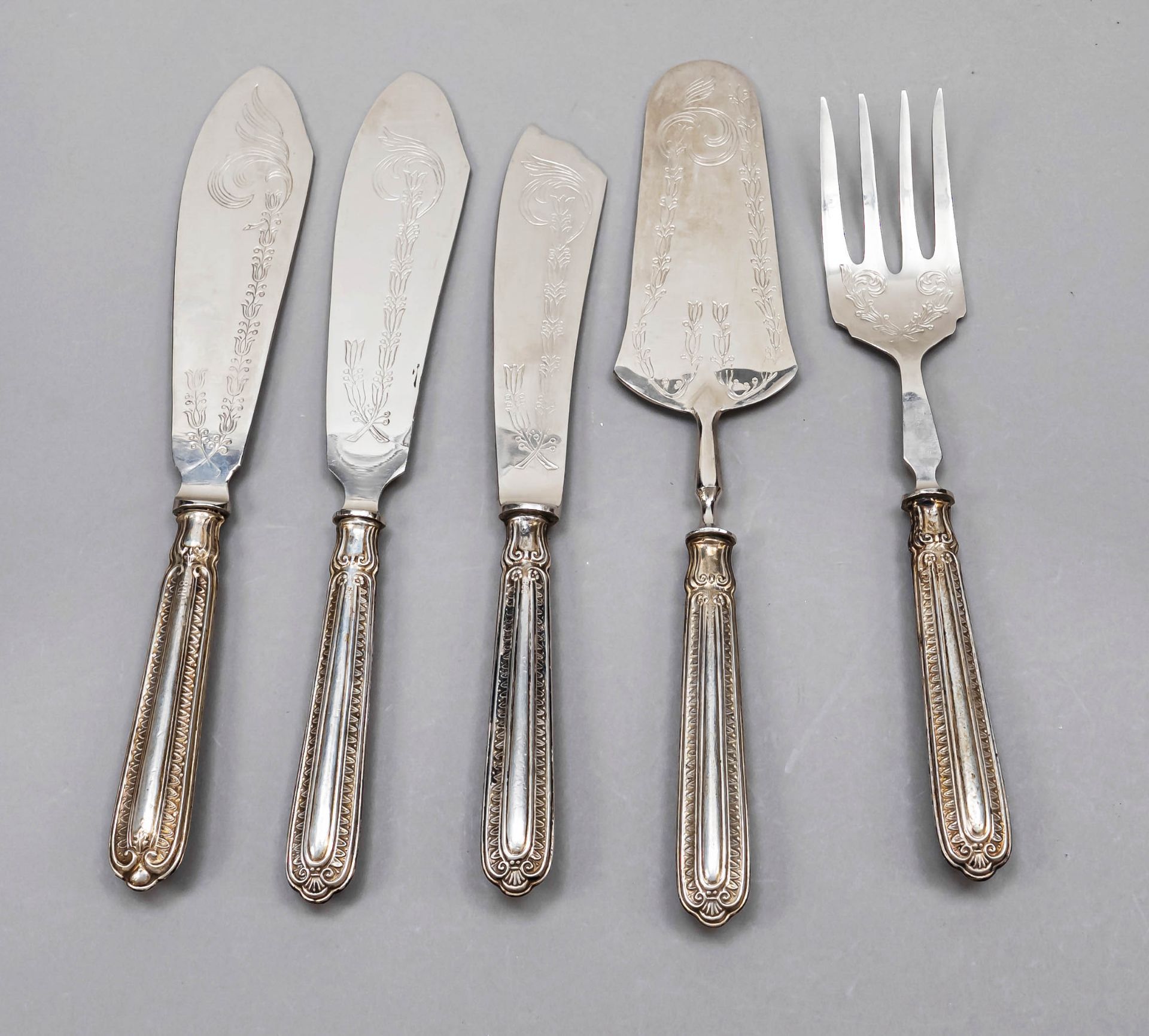 Seven pieces of serving cutlery, 20th century, silver 800/000, filled handles with ornamental relief