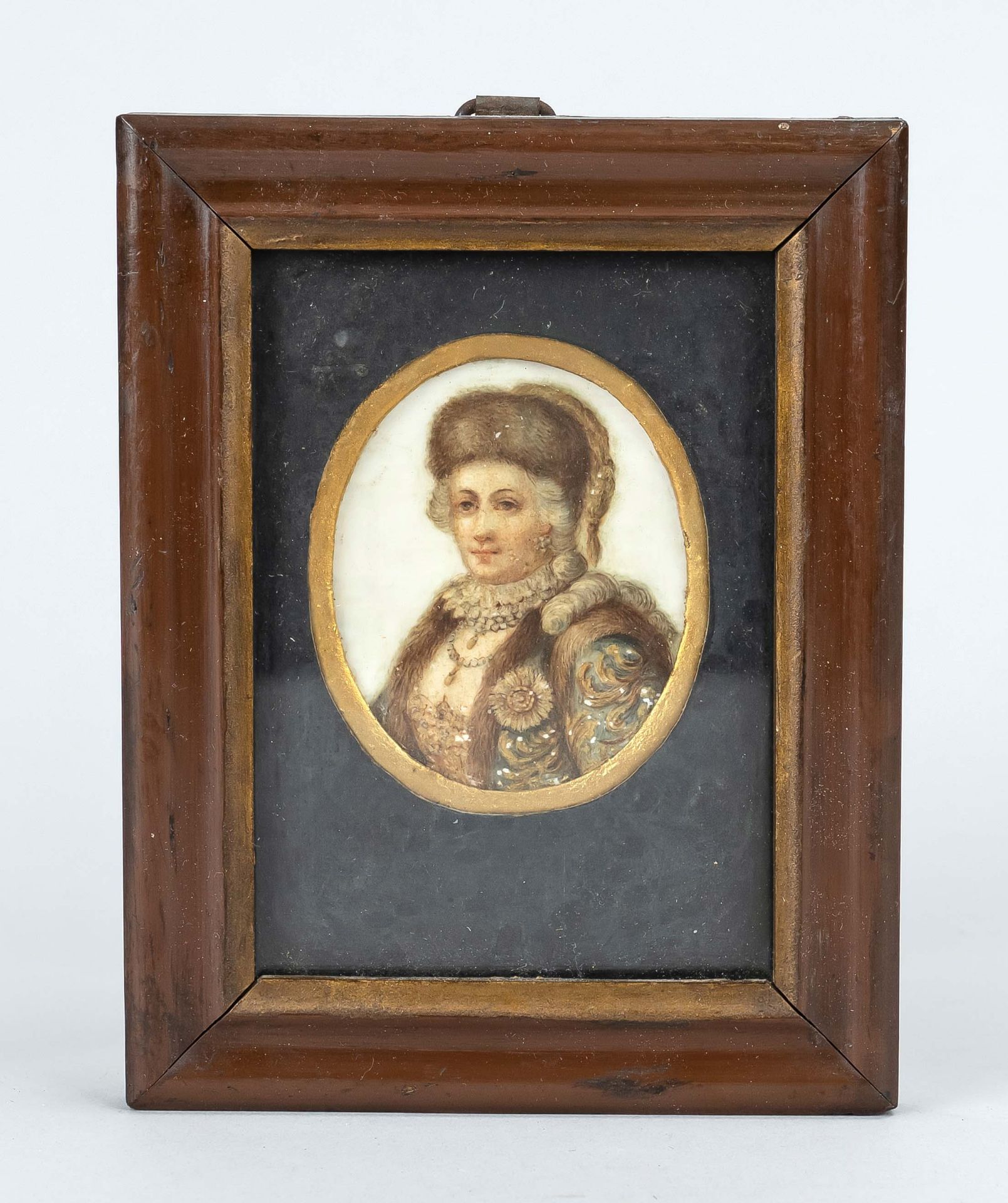 Miniature, probably 19th c., portrait of a lady in fur, polychrome on leg plate. Framed behind glass