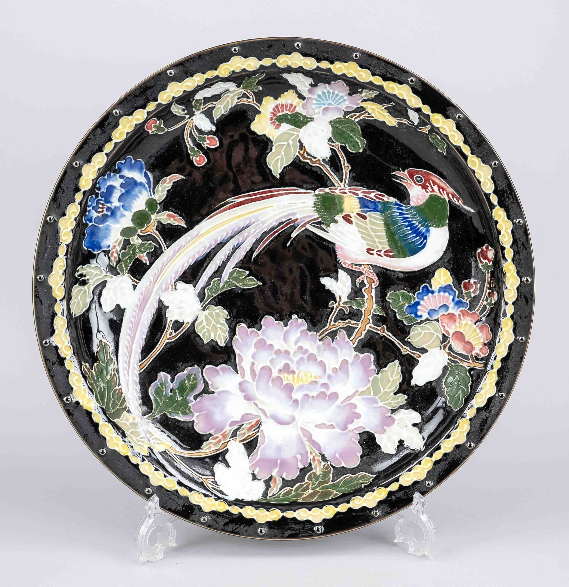 Large plate famille noir, China, 20th c., porcelain with polychrome glaze decoration en relief,