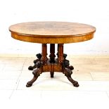 Oval salon table around 1880, walnut veneered, carved with fox heads, extendable (no extension