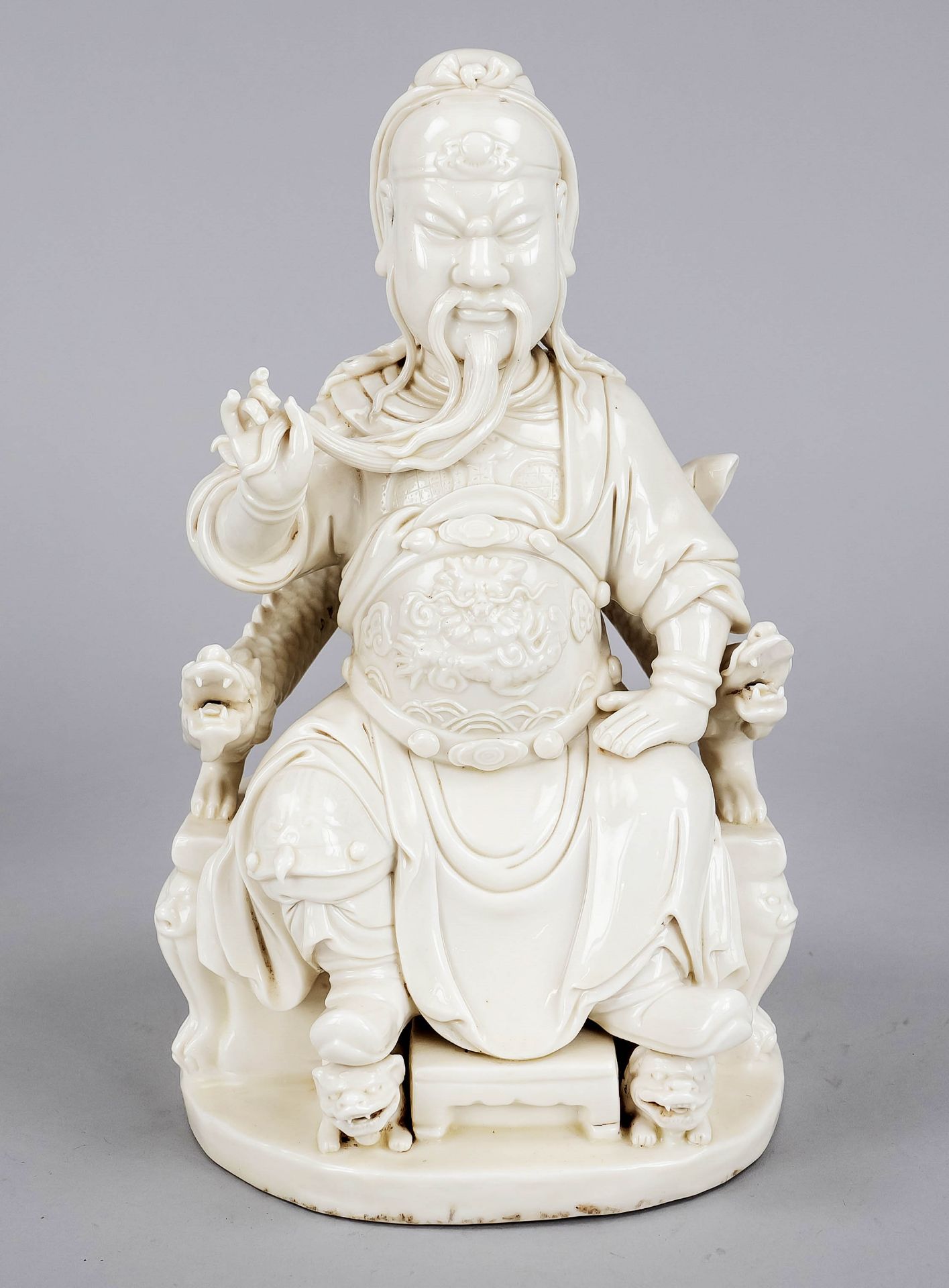 Figure Blanc de Chine ''Guandi on the dragon throne'', China, 20th century, cream-colored