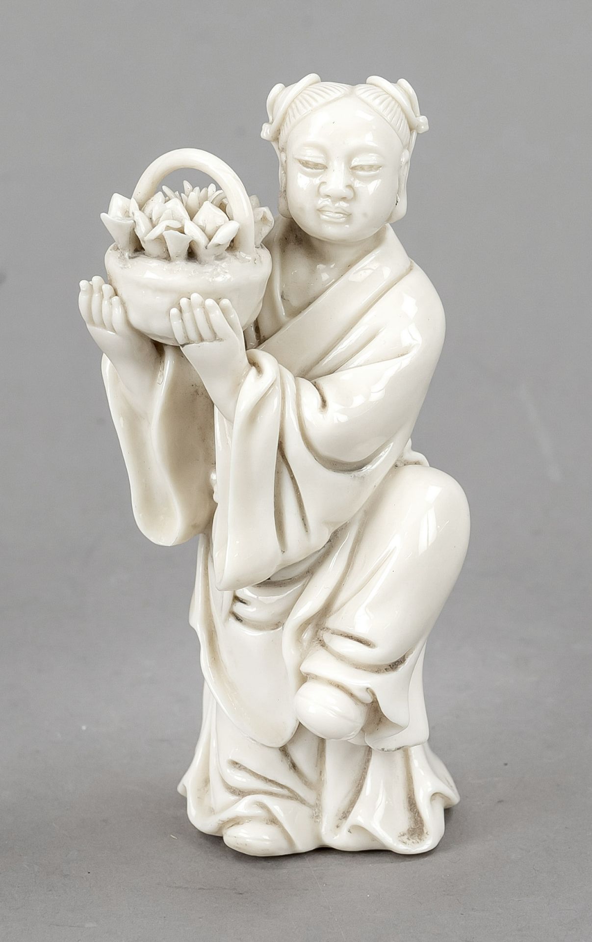 Immortals Lan Caihe Blanc de Chine, China, 19th/20th century, Dehua porcelain one of the 8