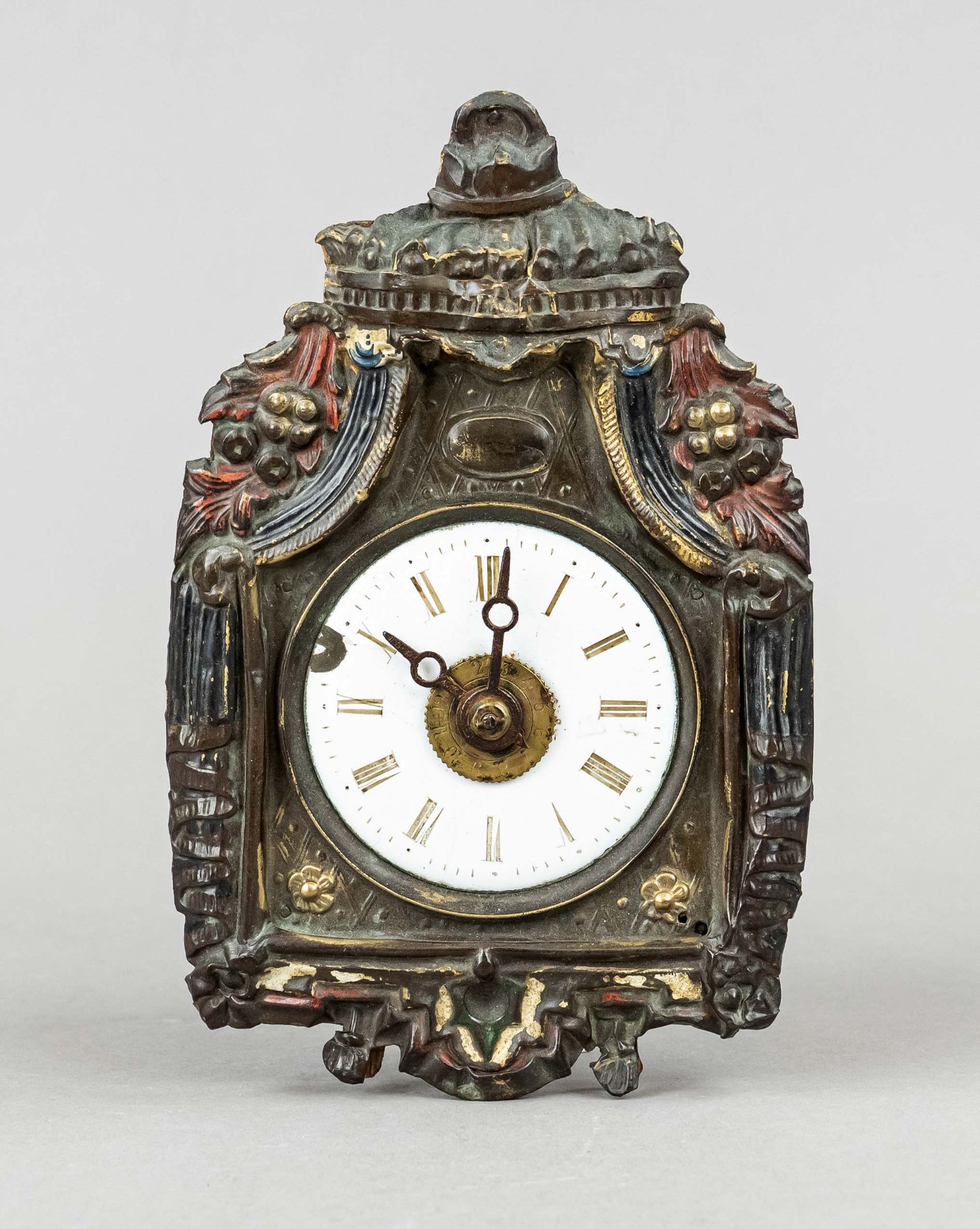 extremely small tartan clock, with wooden stand movement, embossed brass face with depiction of an