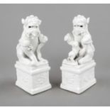 Pair of guardian lions Blanc de Chine, China, 19th/20th c., dehua porcelain of a male lion with a