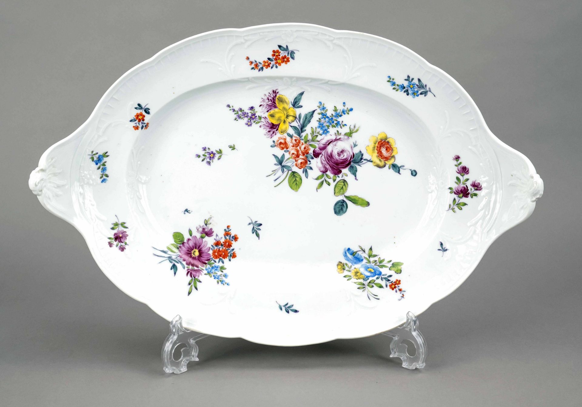 Large rococo serving plate, Meissen, mark 1740-80, oval shape with rocaille handles, on the flag