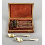 Twelve teaspoons, France, c. 1820, silver 800/000, gilt, tapered handle, with floral relief