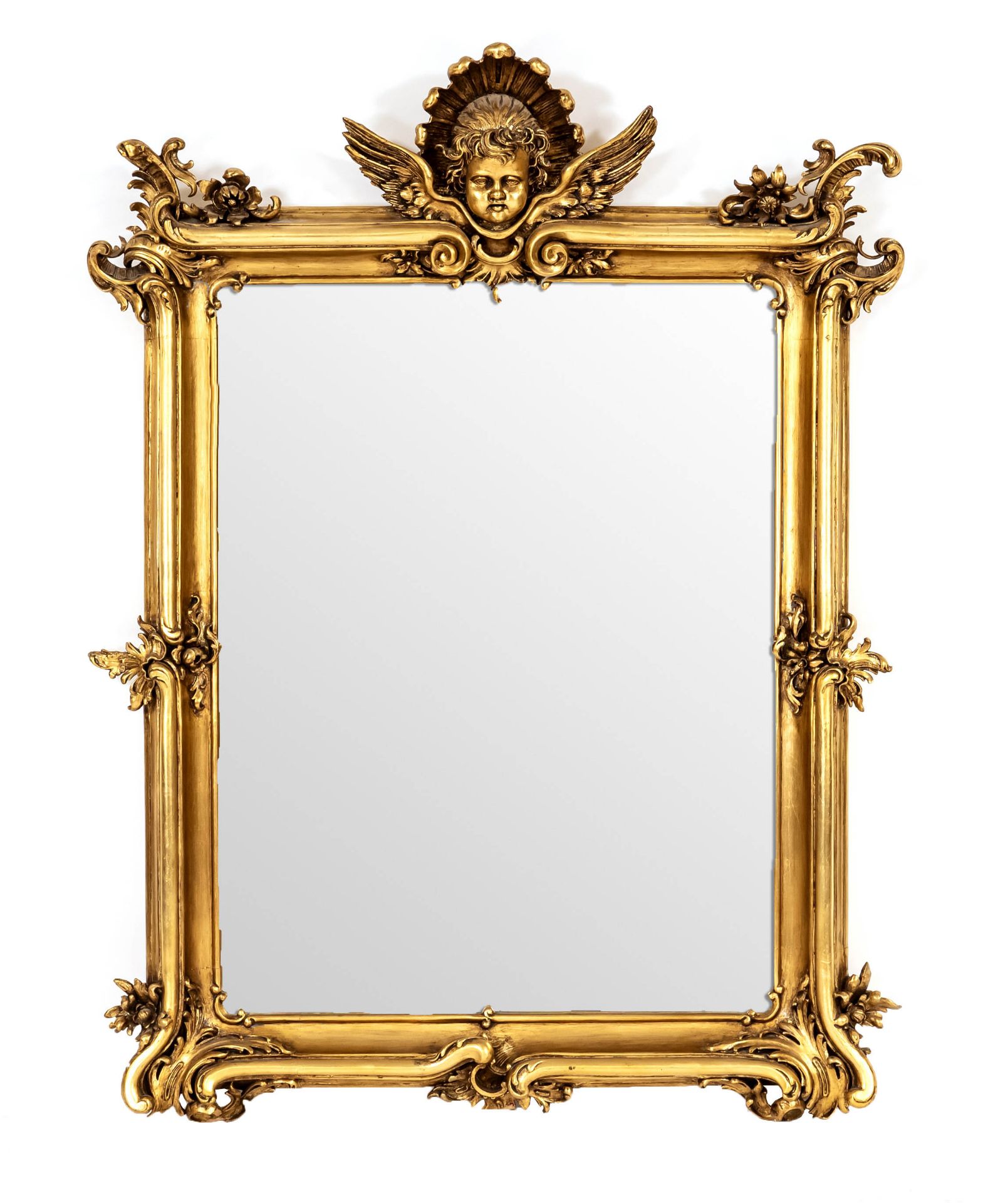 Large wall mirror, mid-20th c., carved wood, stuccoed and gilded, crowned with fully plastic