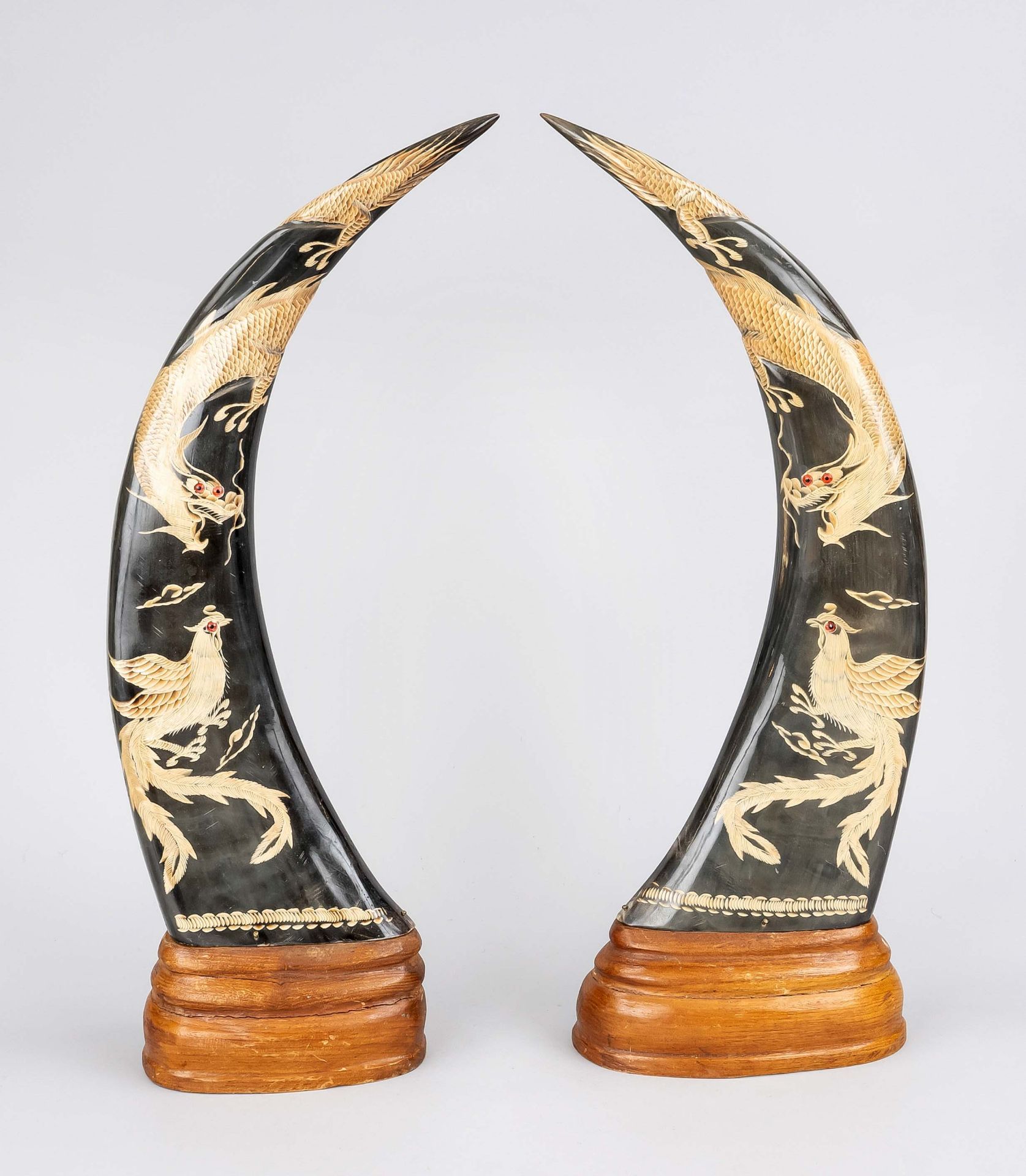 Pair of horn ornaments, Vietnam, 20th c., probably water buffalo with fulminant depiction of