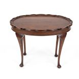 Oval table, around 1900, walnut. Curved edge, slightly curved legs, traces of use, 62 x 79 x 50 cm.