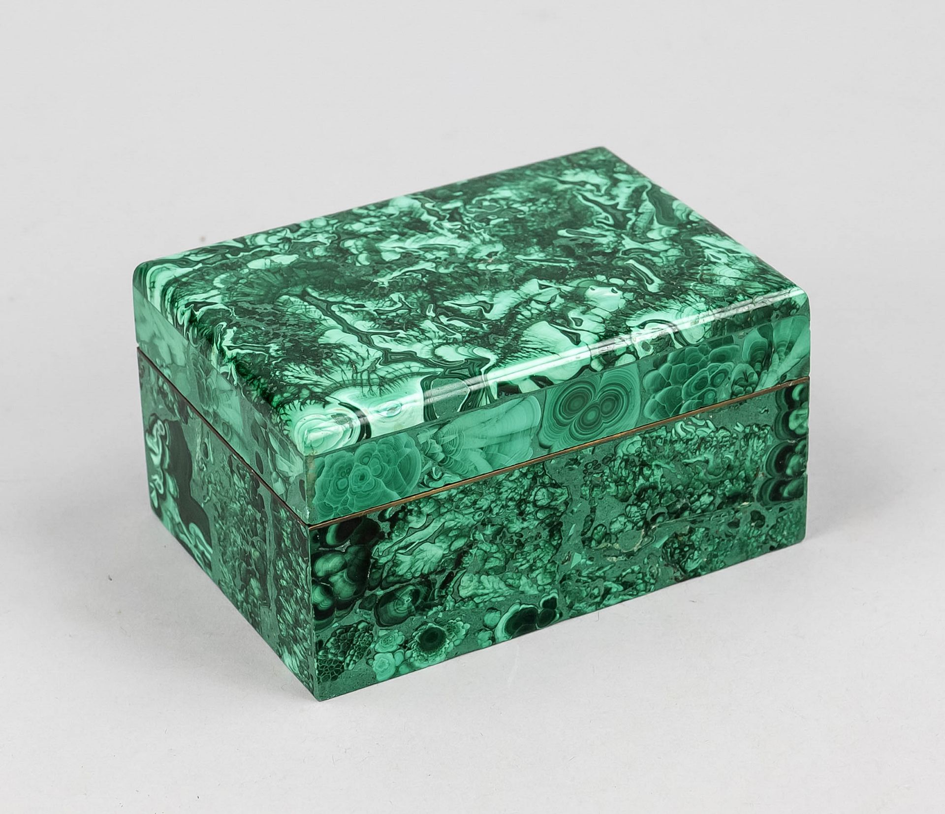 Lidded jar, early 20th century, malachite. Strictly rectangular form, lid overlay with brass band,