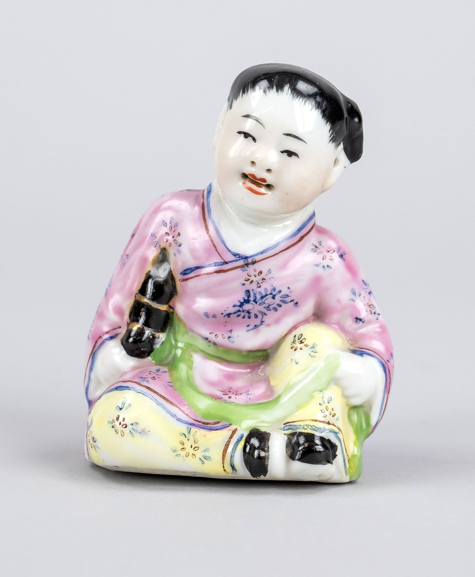 Figure of a laughing girl, China, Republic period(1911-1949), porcelain with polychrome glaze