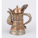 Monk's head jug, Nepal, 19th/20th c., chased copper and white metal, repoussé ornamental fittings