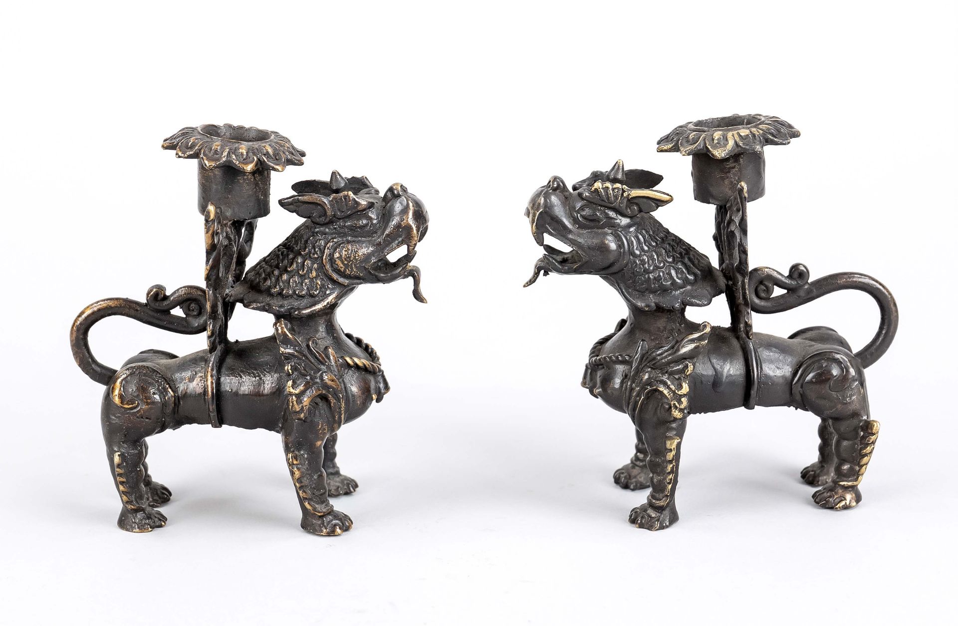 Pair of lion candlesticks, Nepal, 20th c., brass casting of two temple lions in Nepalese style