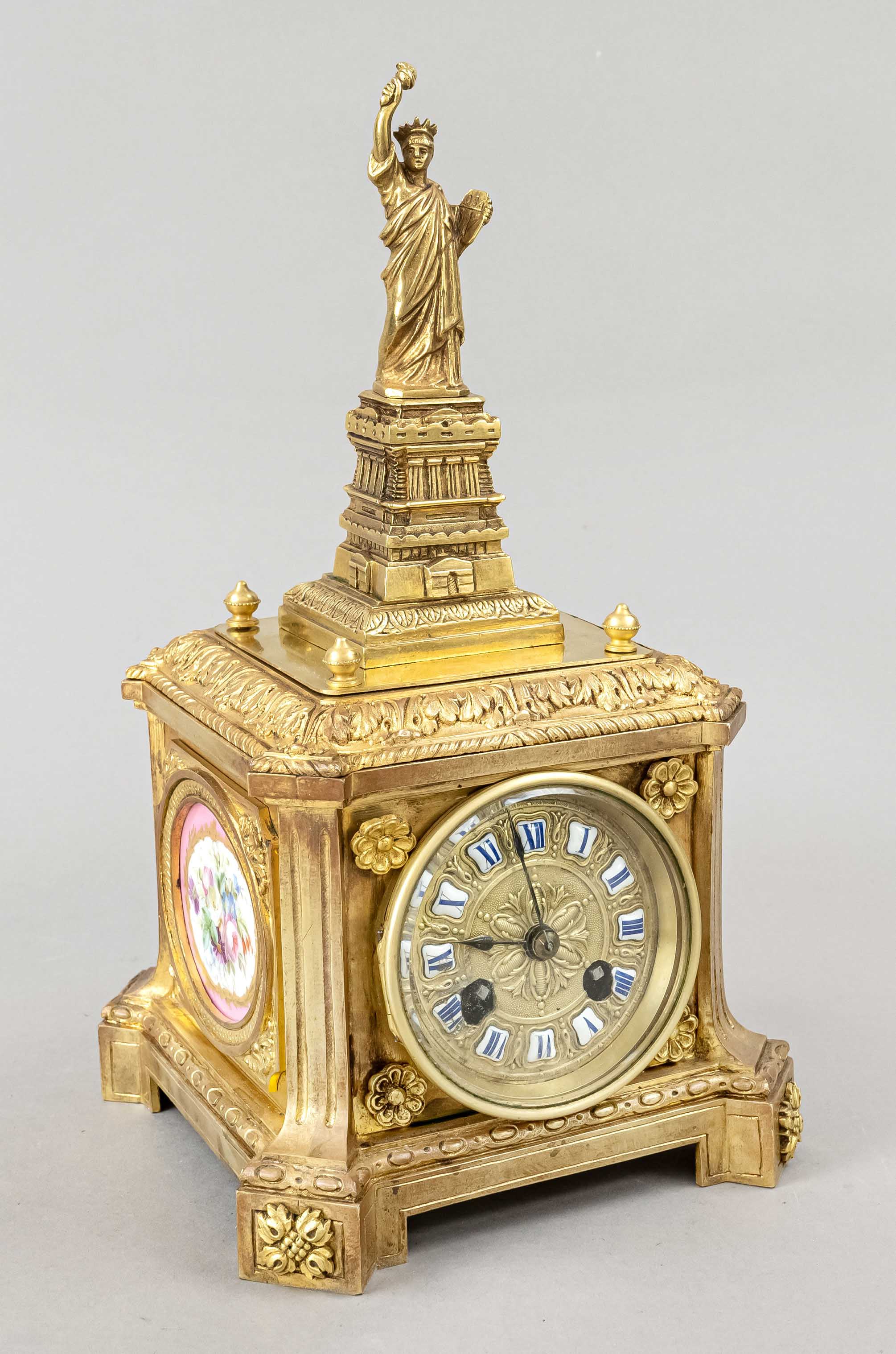 qudratic figure pendulum, with statue of joy, 2nd half of 19th century, case decorated with leaves