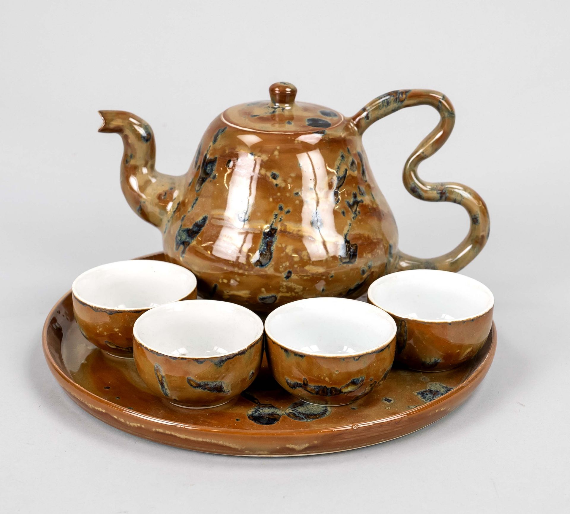 Amber tea set, japan, 20th c., porcelain with so called oil stain glaze, pot on round tray with 4