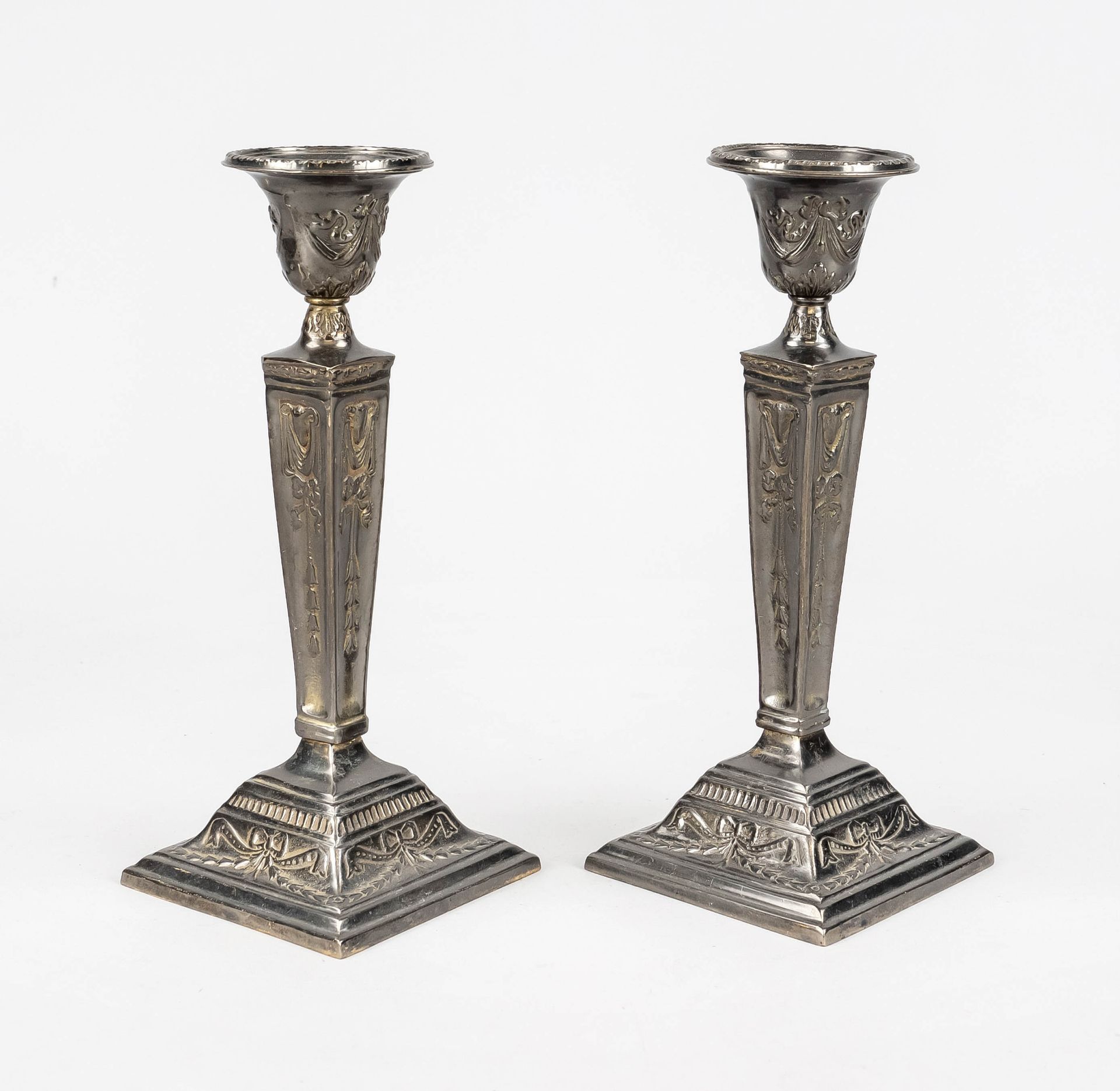 Pair of candlesticks, late 19th century, brass/bronze silver plated. Square, profiled and ornamented