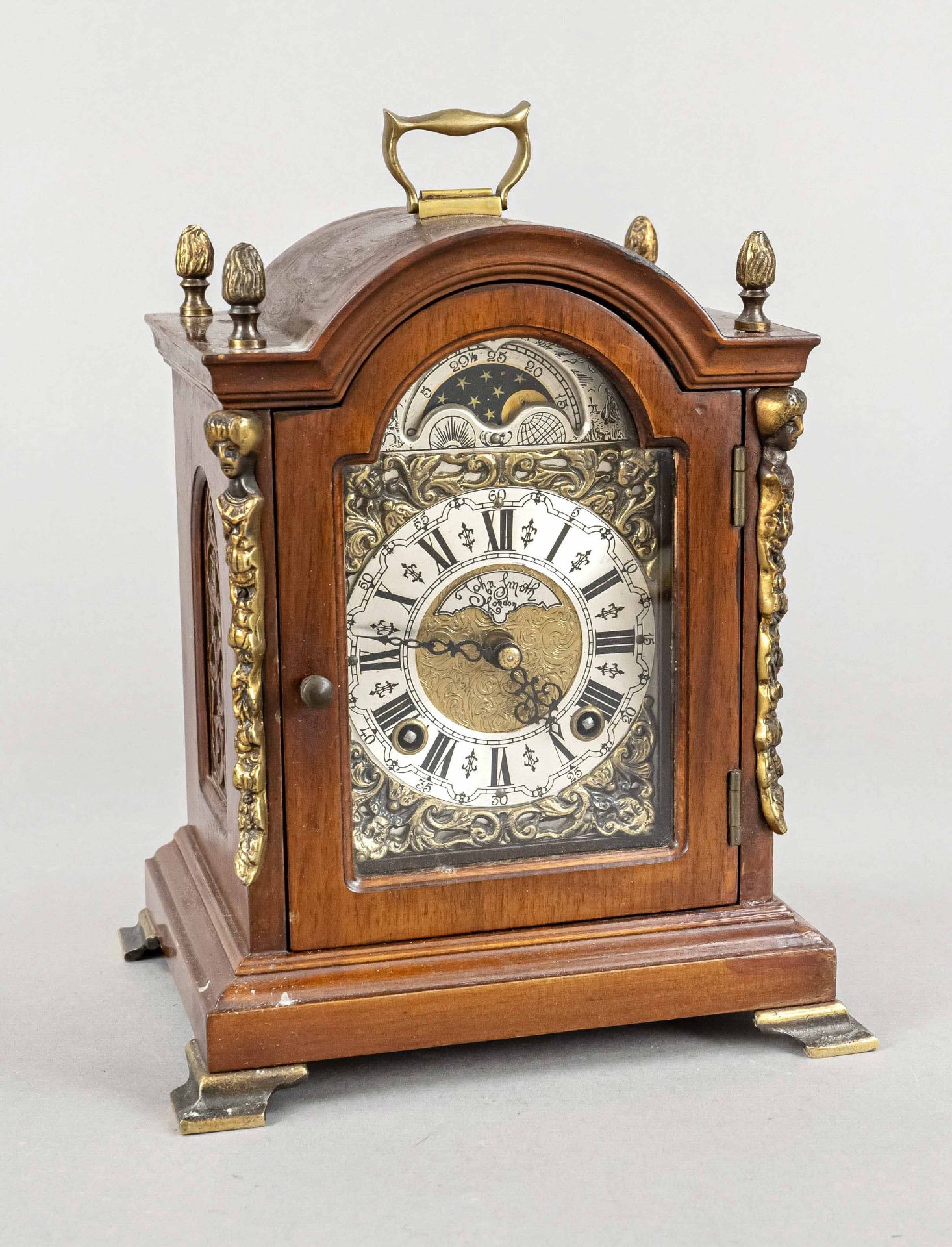 Table clock, 20th c., mahogany, floral engraved brass dial with applied silver-f. Roman numerals,