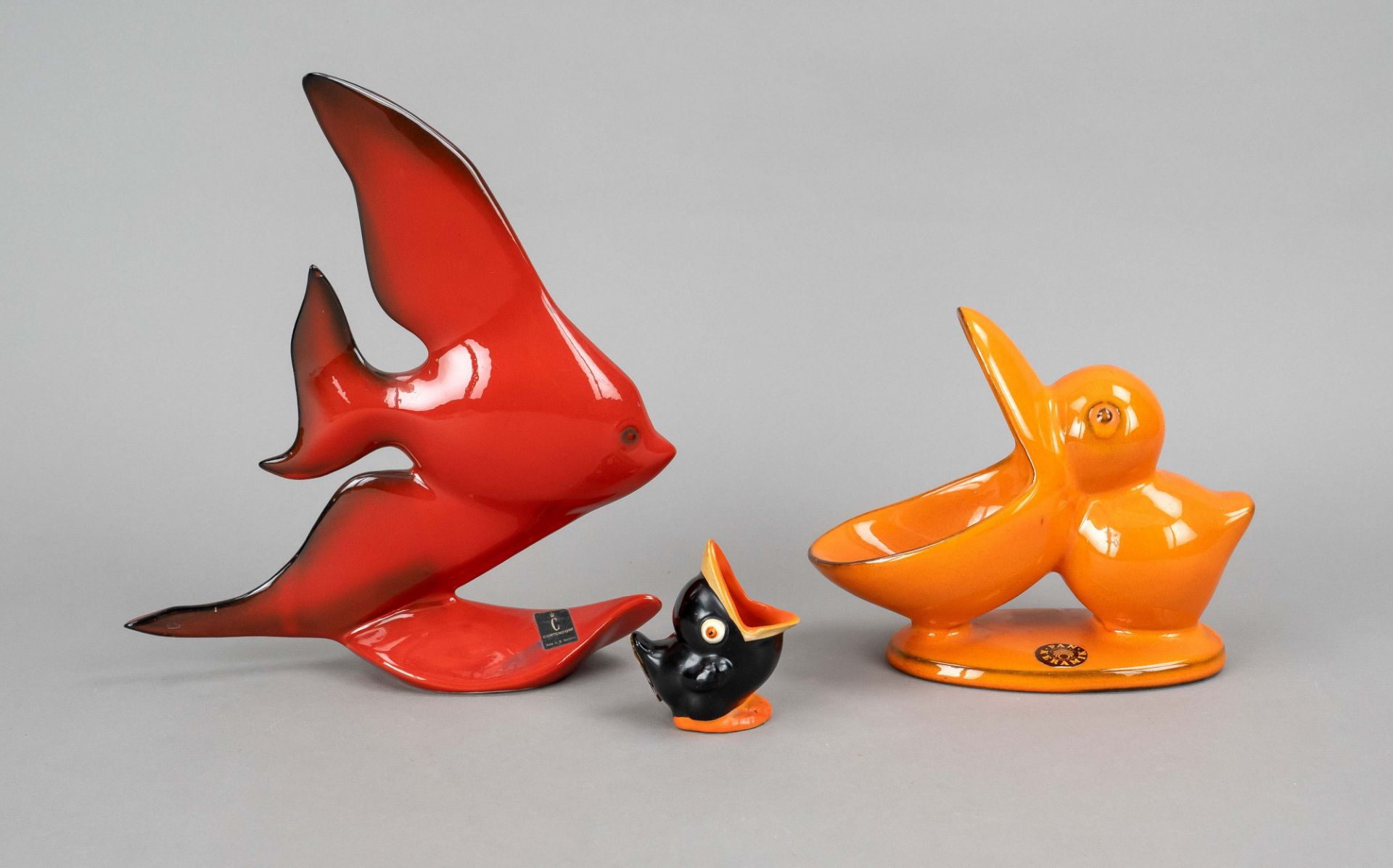 Three ceramic figures, 20th c., fish, with adhesive label Cortendorf, red glazed, h. 25 cm, 2 birds,