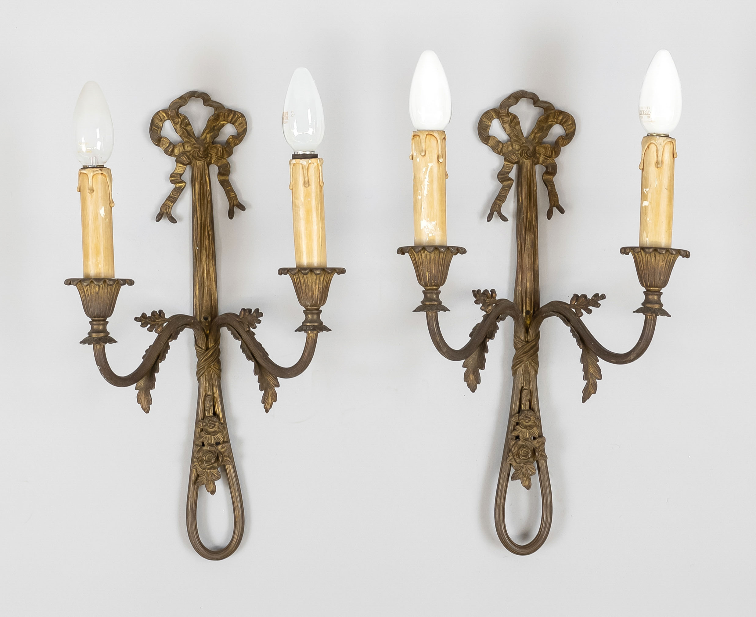 Pair of wall lamps, late 19th c., brass with residual gilding. Each with 2 curved perennial