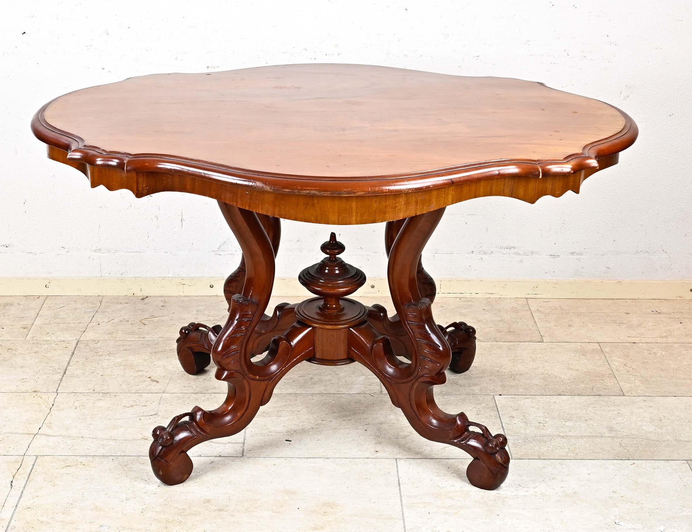 Louis-Philippe salon table around 1870, mahogany, curved top with corresponding frame on curved