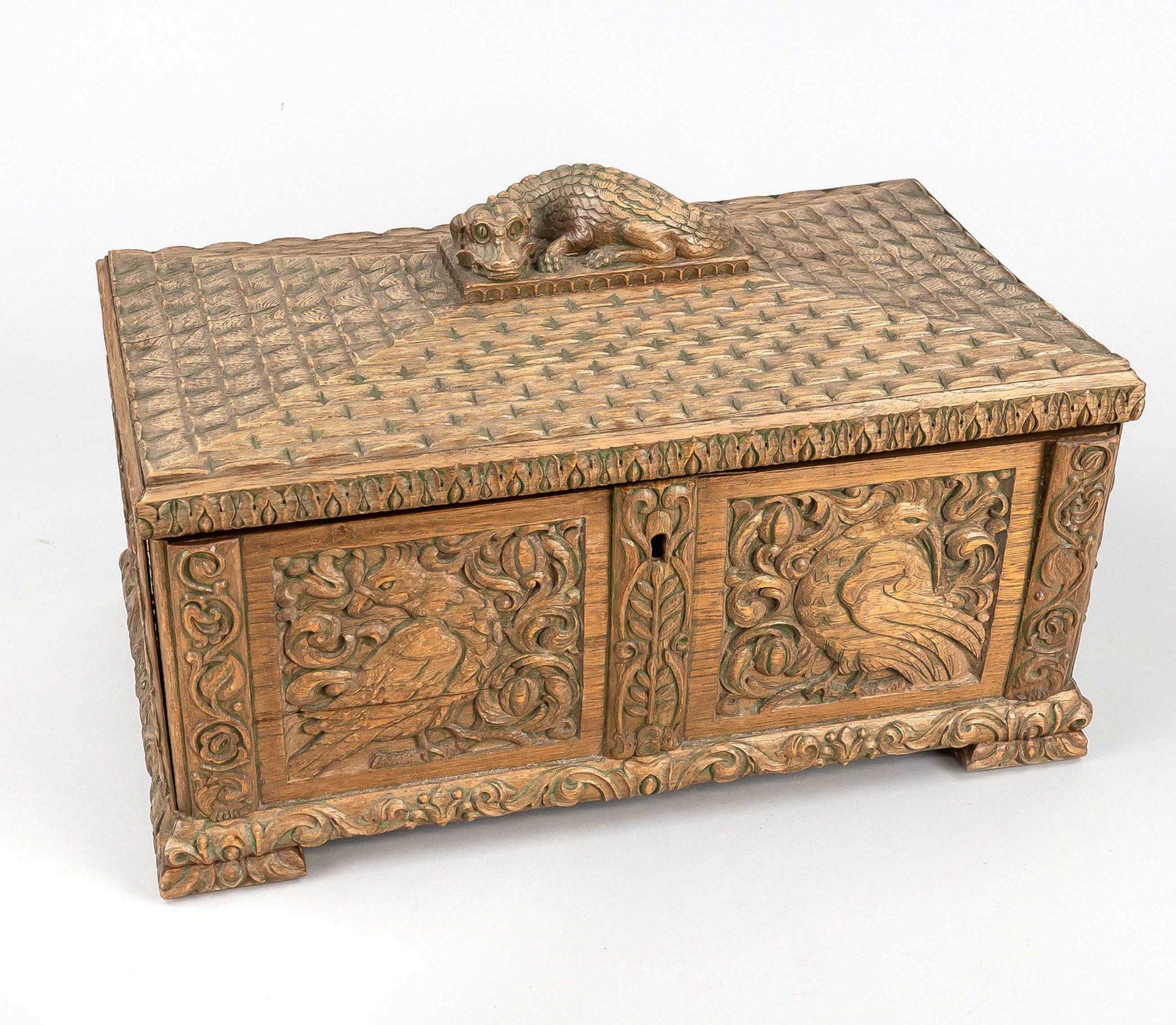 Chest-shaped box, early 20th century, oak wood. Rectangular body on pressed feet, the walls with