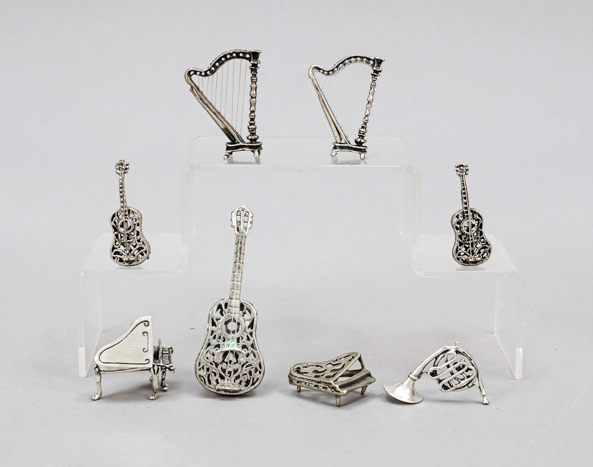 Eight miniature instruments, 20th c., silver various finenesses or tested, 2 grand pianos, 2