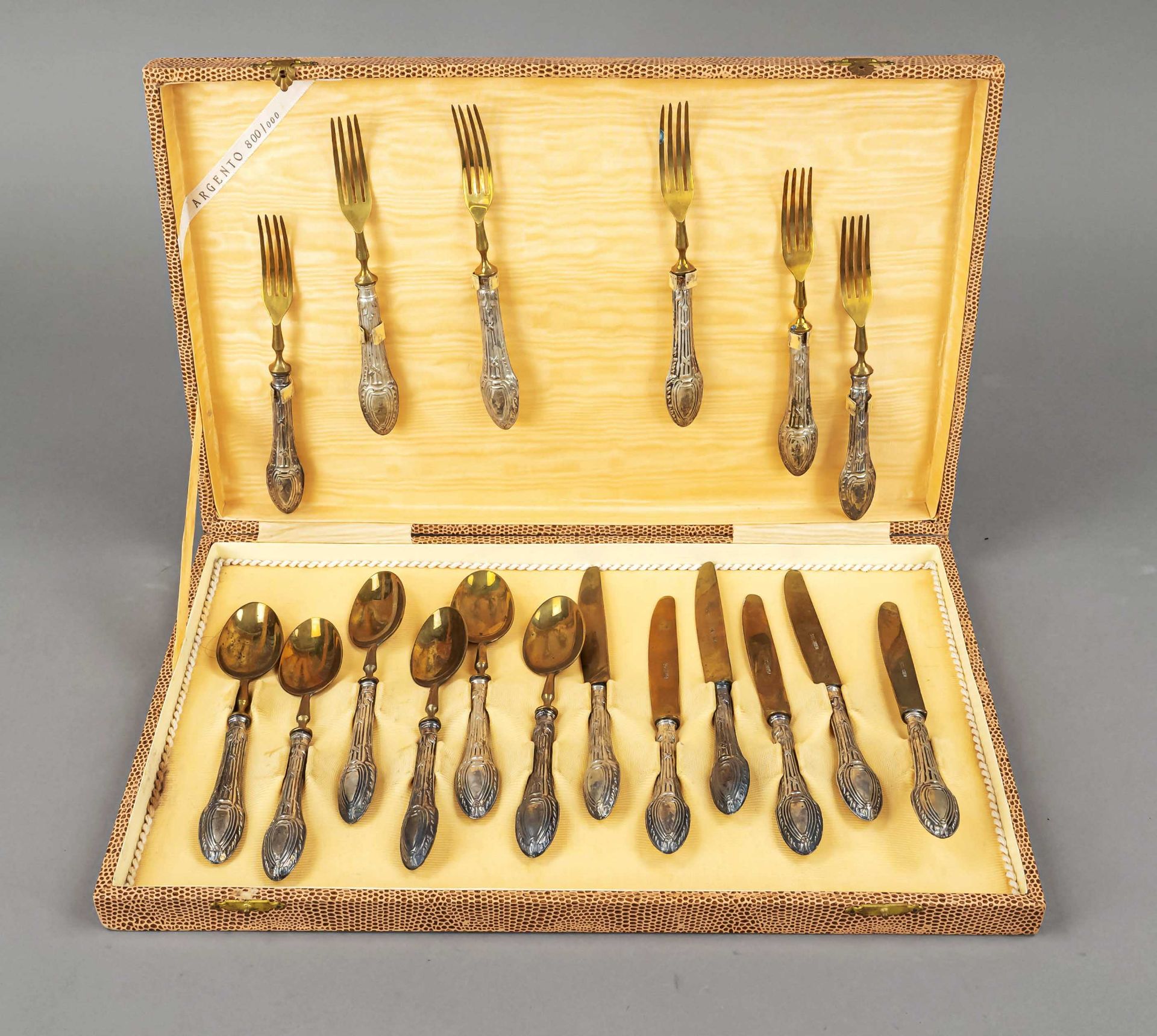 Dessert cutlery for six persons, 20th c., silver 800/000, filled handles with relief decoration, 6