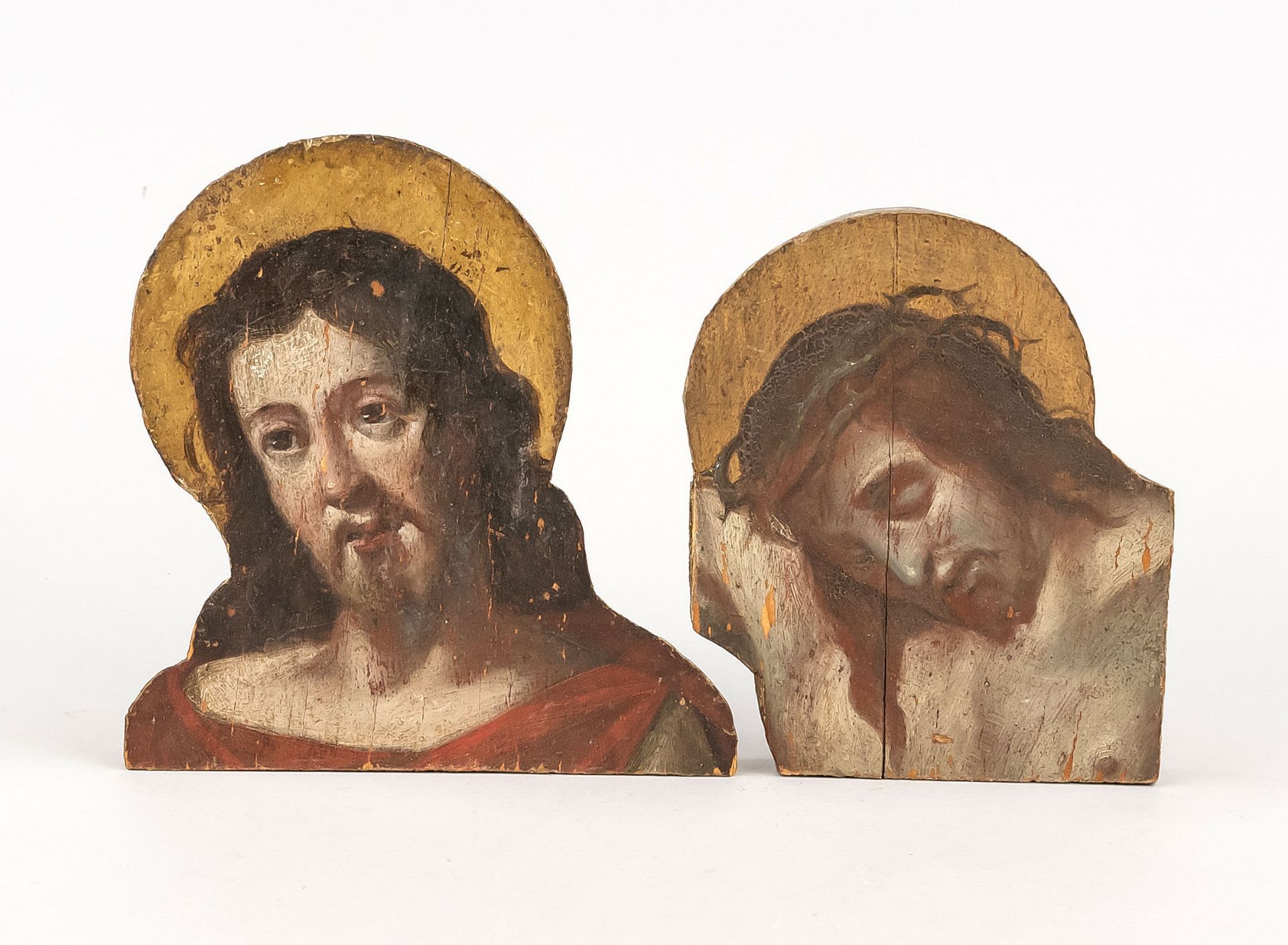 2 Christ heads, probably 19th c., polychrome and gold on wood, probably parts of a larger figure,