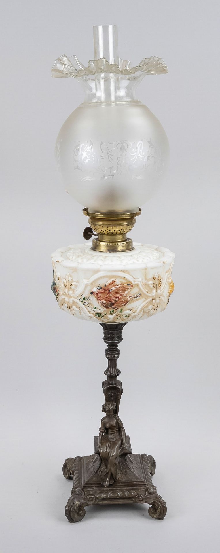 Petroleum lamp, late 19th century, ornamented base on 4 feet made of white metal patinated with