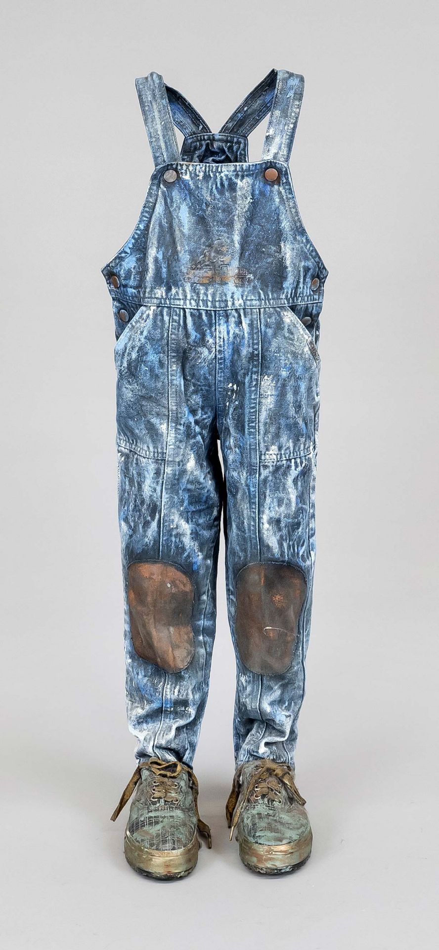 Contemporary sculptor, standing dungarees with sporty sneakers, cheeky figure made of a prepared