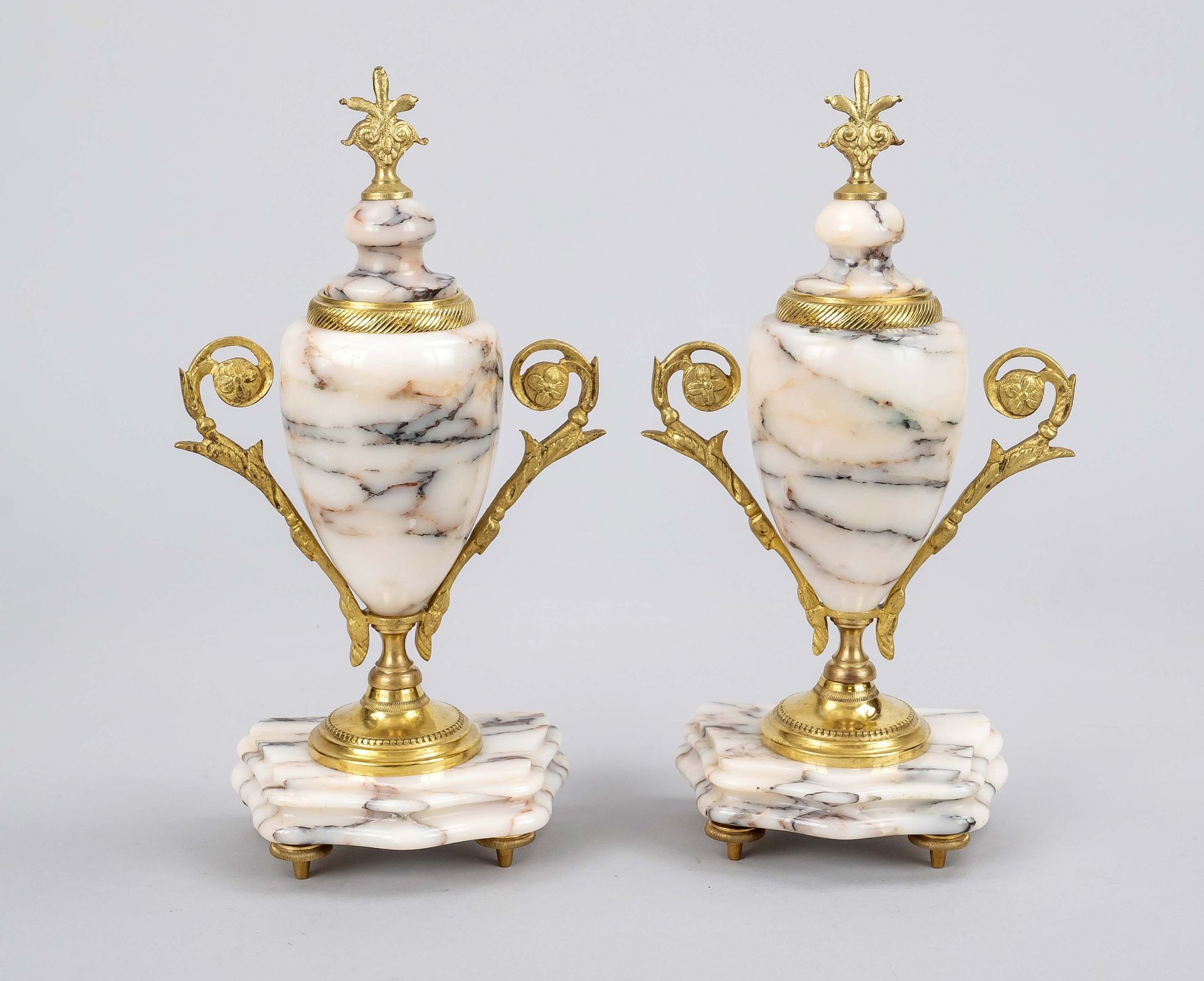 Pair of ornamental vases/side plates, 1st h. 20th c., polished stone with brass mount, h. 27 cm.