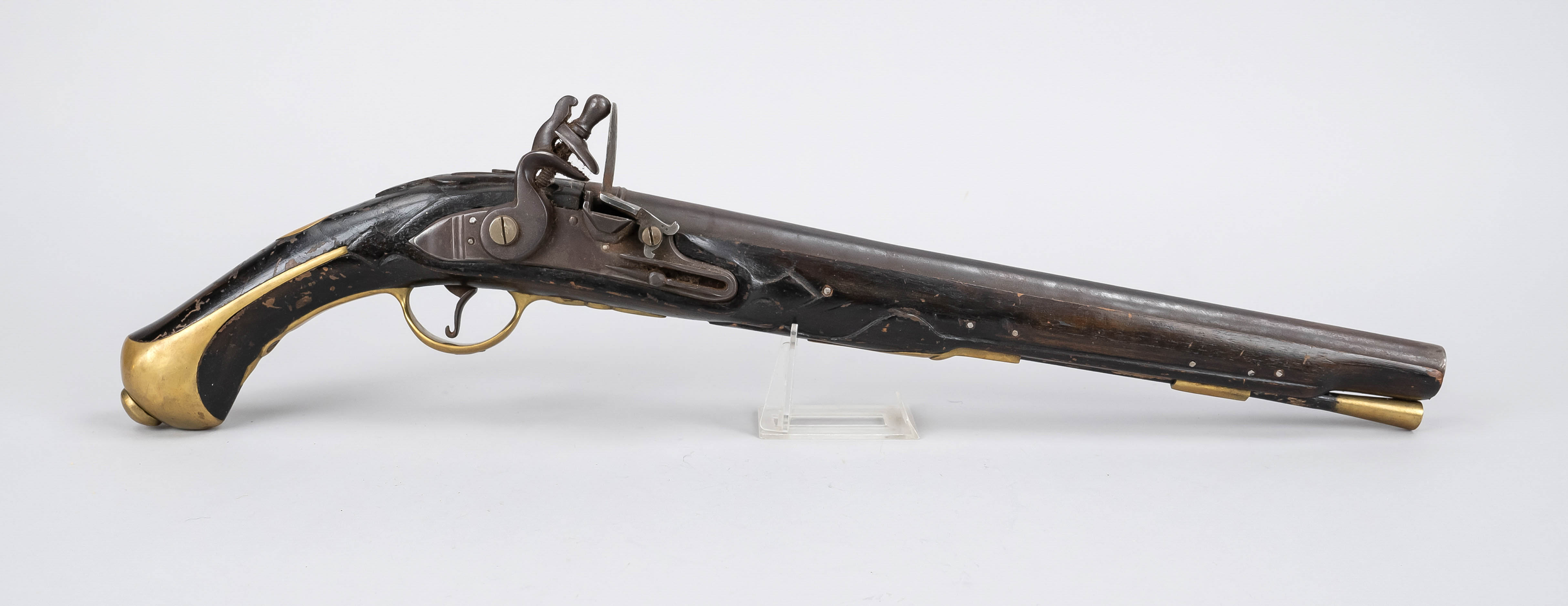 Flintlock pistol, 18th century, handle and stock made of dark wood with brass elements, iron barrel,