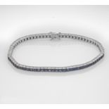Sapphire riviére bracelet WG 750/000 with 72 faceted sapphire carrées, total 7.20 ct darker blue,