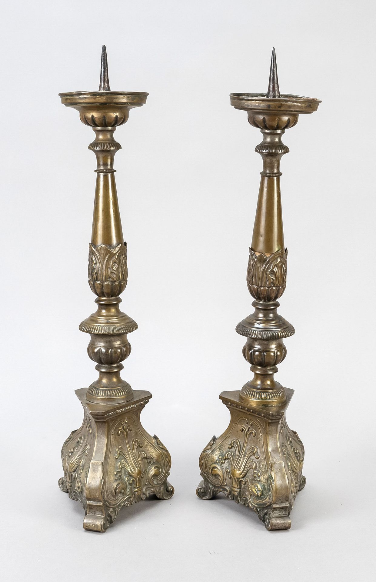 Pair of high candlesticks in baroque style, 19th c., brass sheet, h. without spike 42 cm.