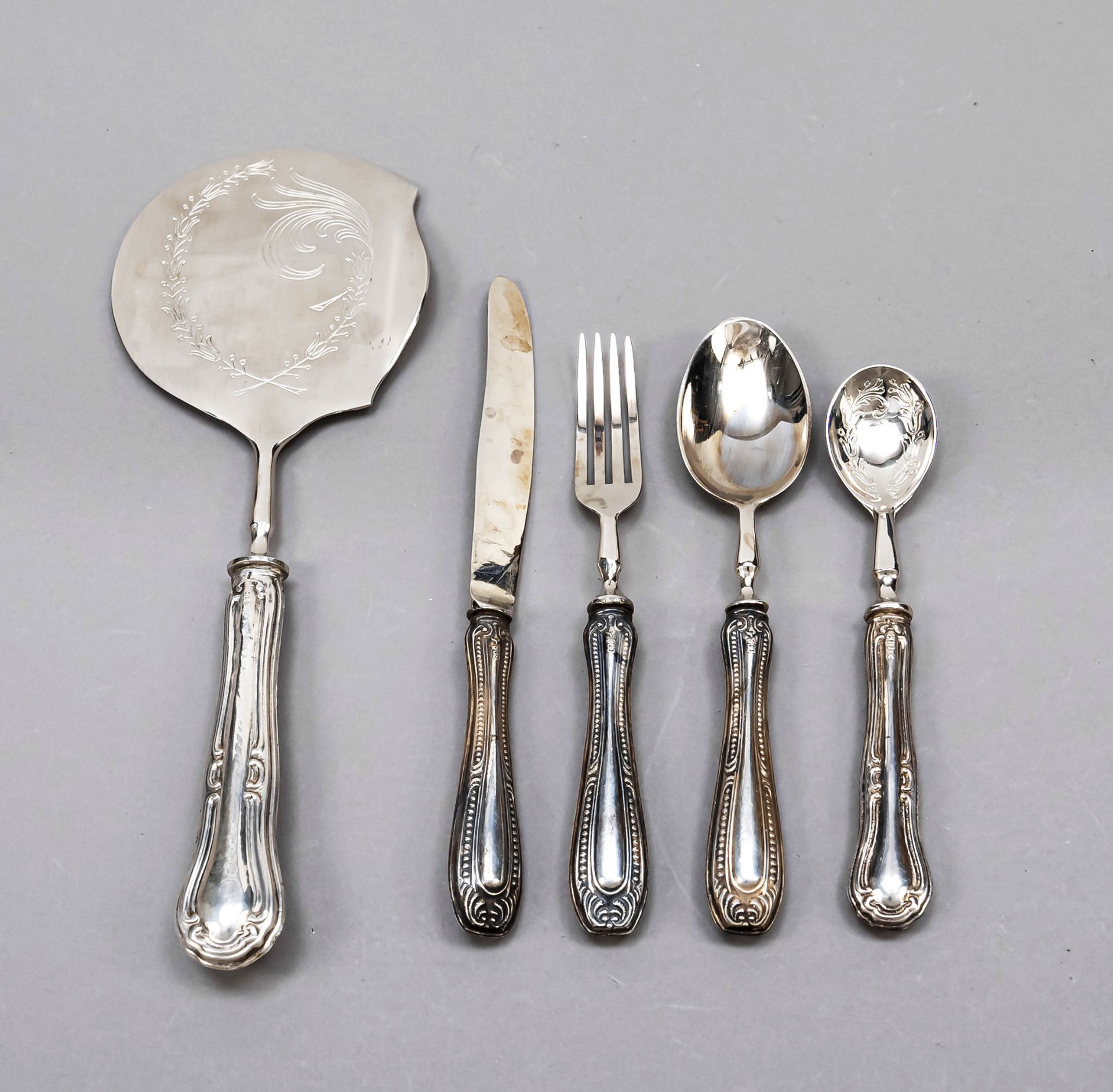 22 pieces of cutlery, 20th c., silver 800/000, 3 different decorations, each filled handles with