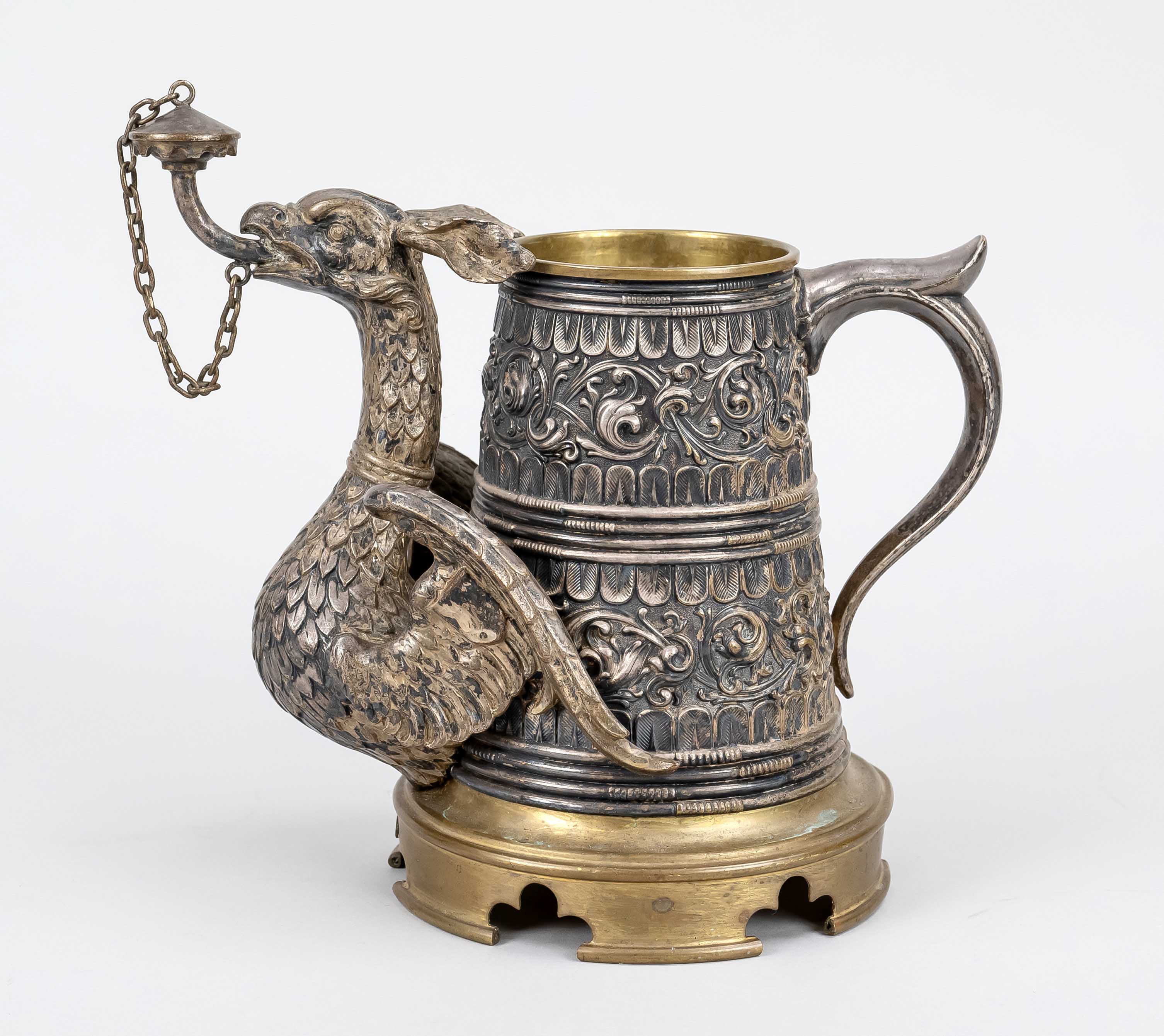 Griffin jug with oil lamp, 19th c., brass and metal casting. The jug is made of brass and metal