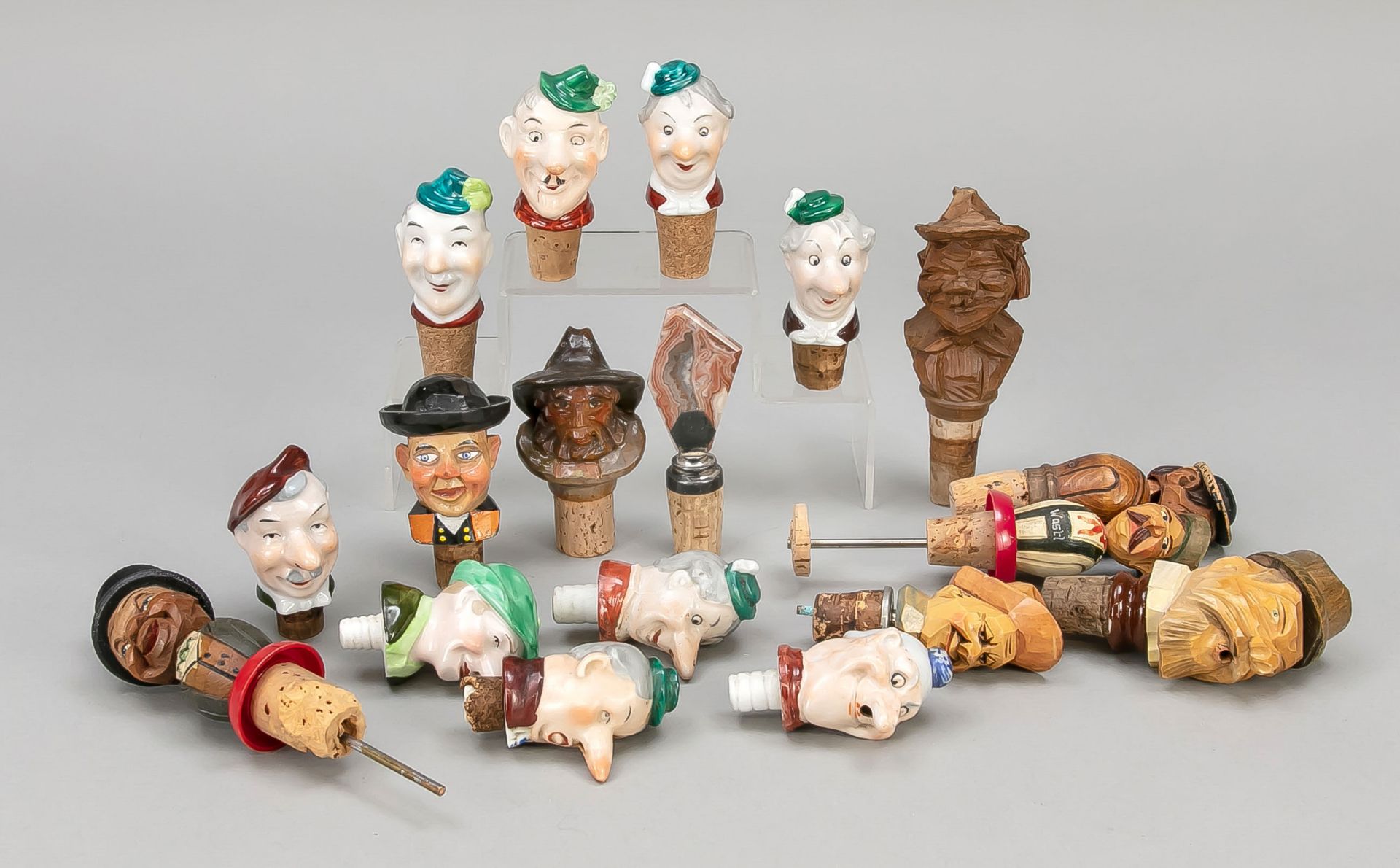 Mixed lot of figural stoppers (ca. 18 pieces), 20th c., ceramic/porcelain polychrome glazed and wood