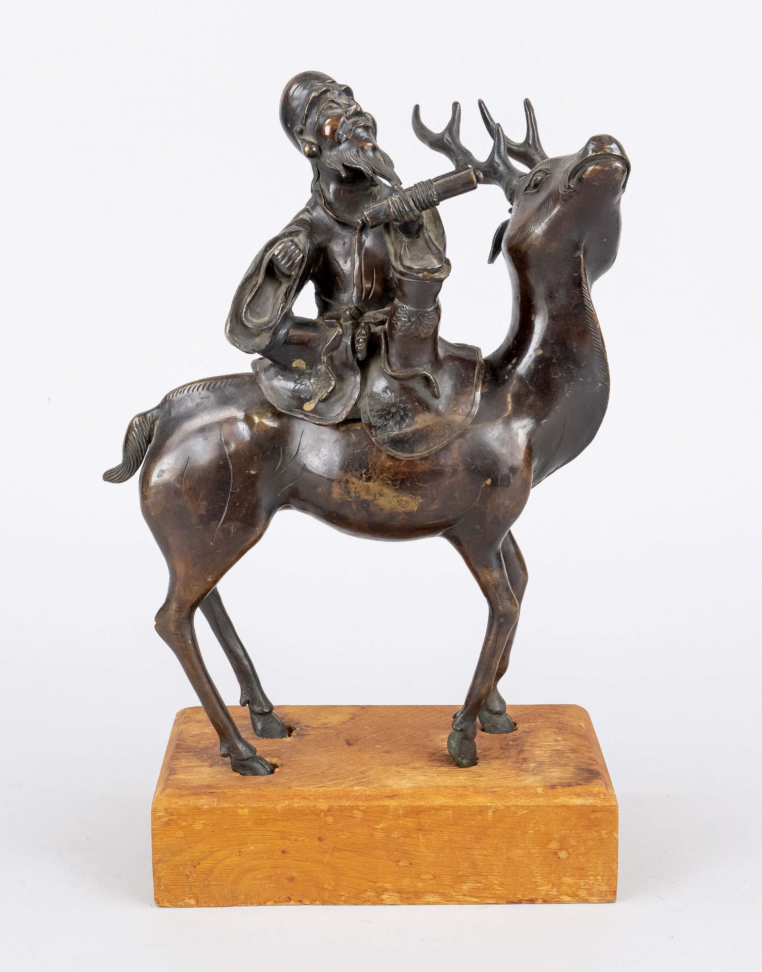 Asian sculptor of probably 19th century, figural bronze vessel in the shape of a stag with a man