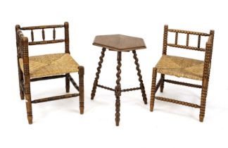 Two wicker chairs and a small table around 1900, oak, h. table 60 cm, d. 46 cm.