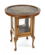 Game table and showcase around 1920, oak, all sides glazed with star cut, brass top with