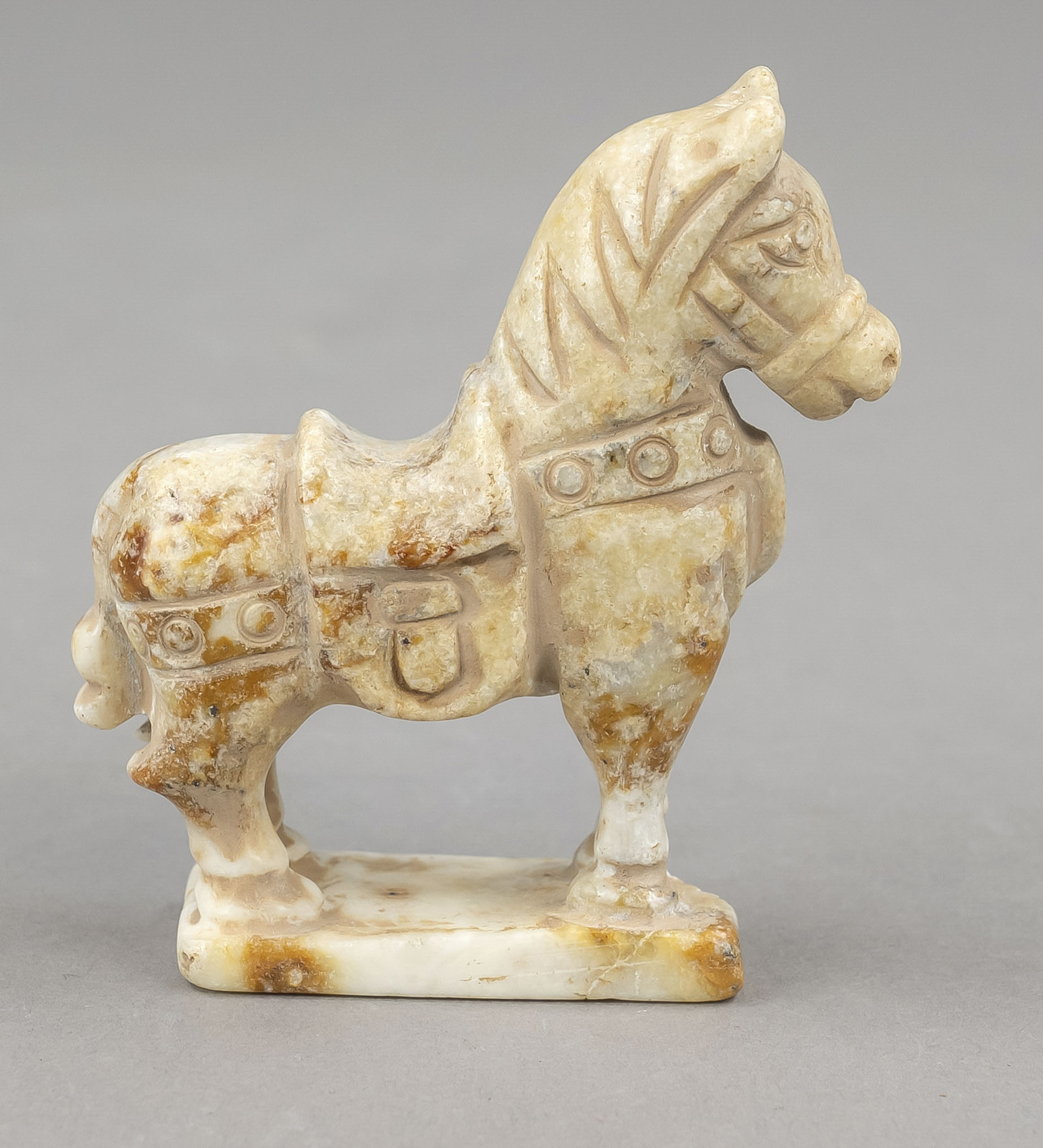 White horse, probably India 19th/20th century, finely carved into mineral saddled horse on plinth,