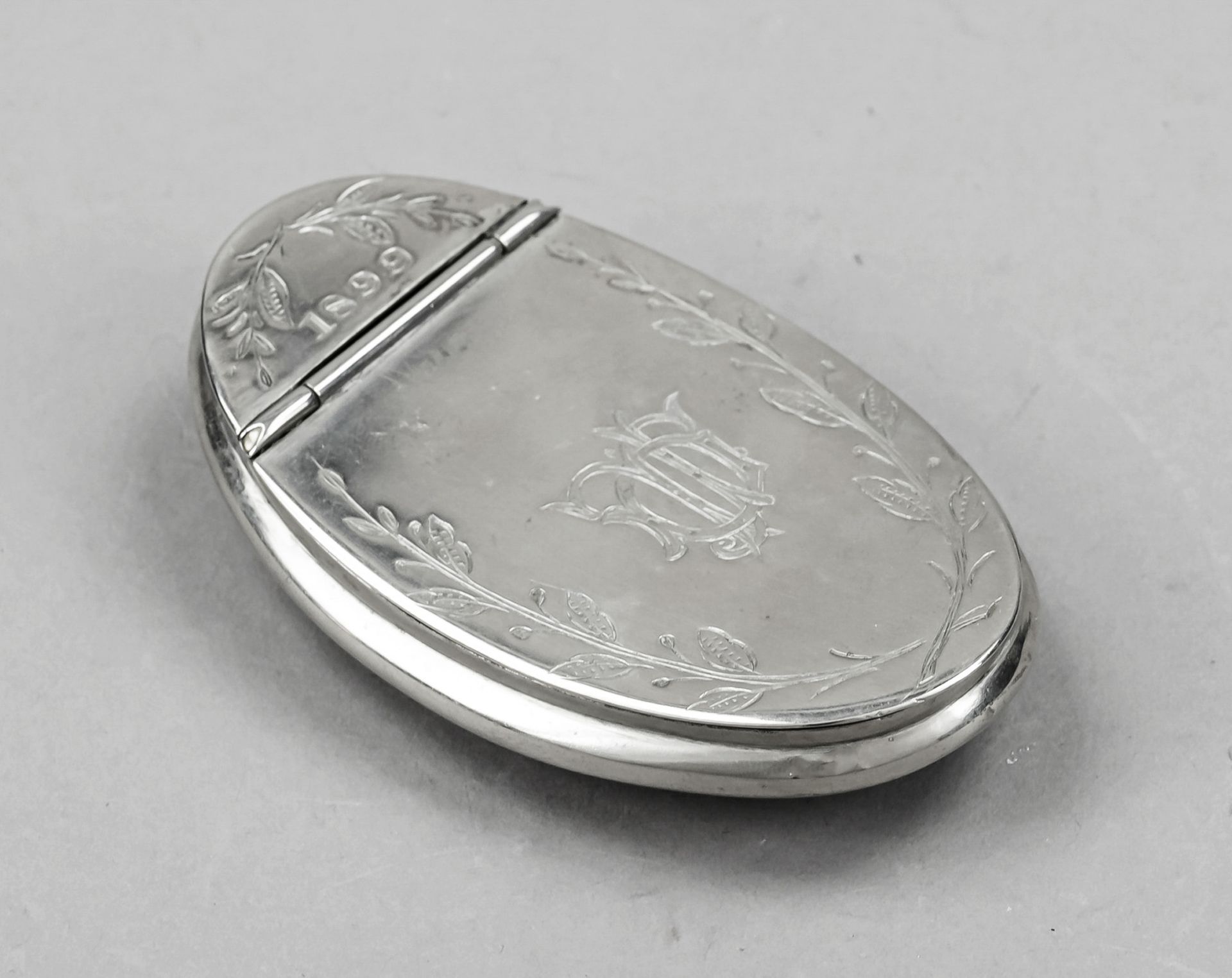 Oval case, late 19th century, plated, curved shape, arched sides, flat hinged lid, wall with