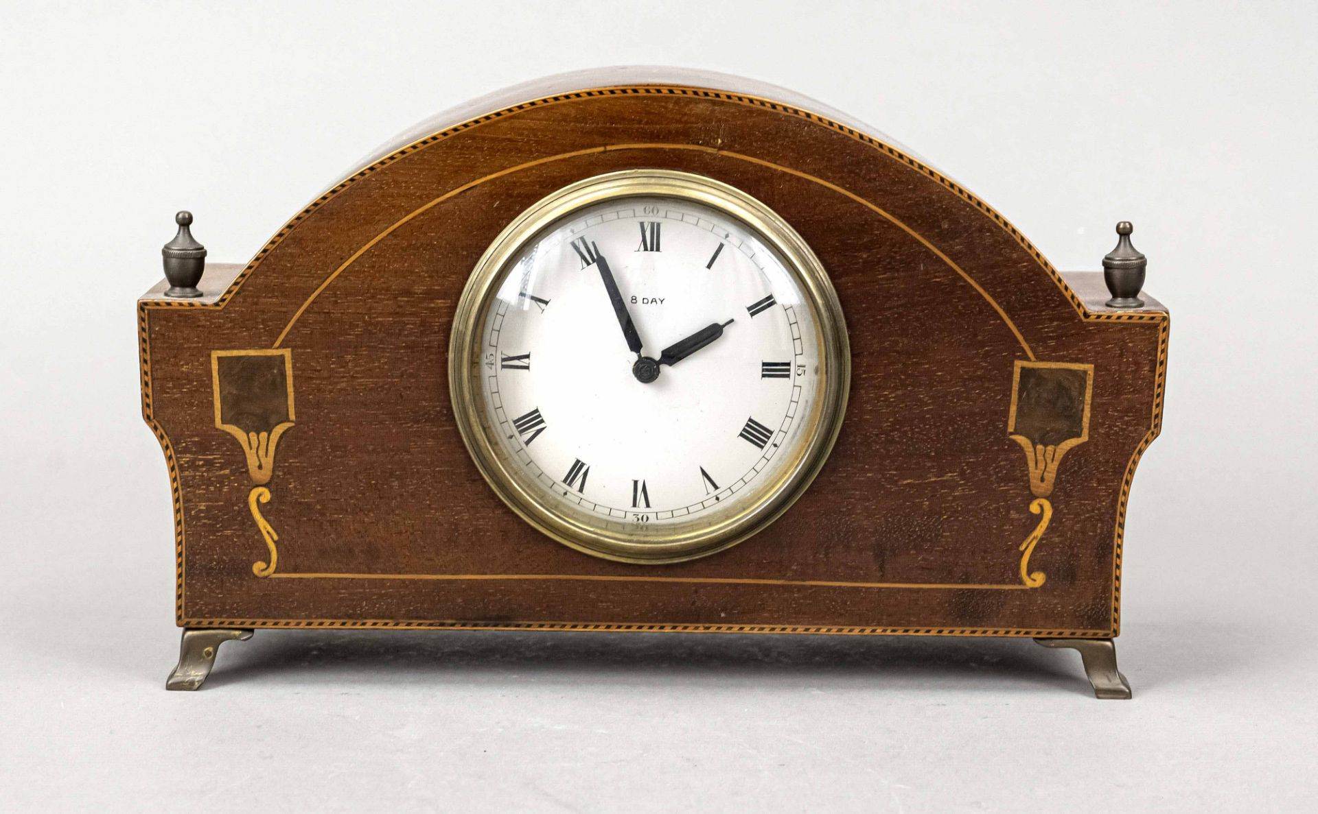 Wooden table clock, early 20th c., mahogany, polished case with fine thread inlays, silverf. Dial