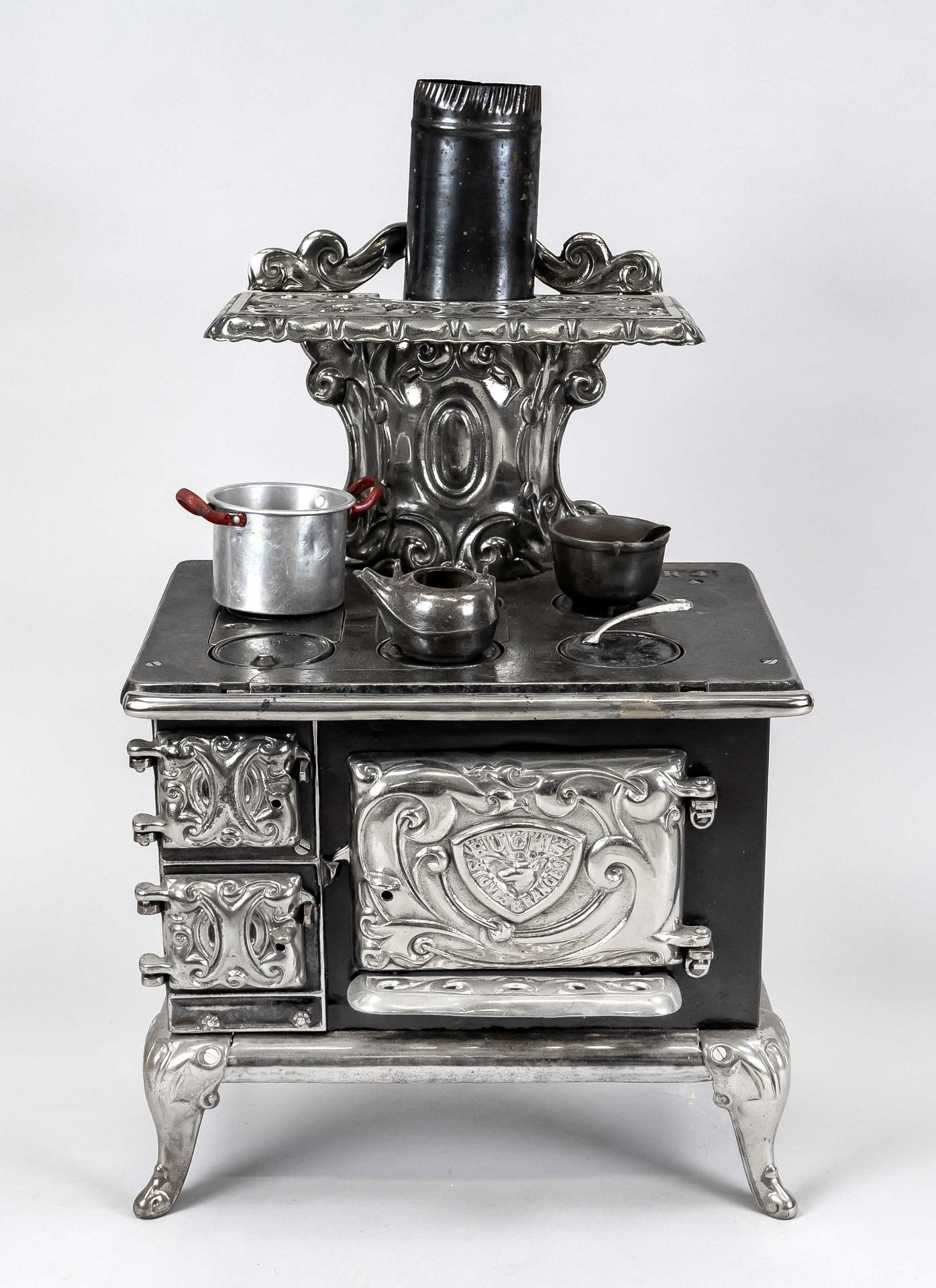 Toy stove, probably England, 19th/20th century, iron partially chrome/nickel-plated. Marked on the