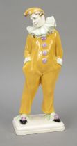 Standing Pierrot in yellow costume, 20th c., ceramic, expressive Pierrot on rectangular base,