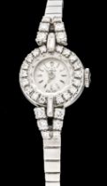 Lotos ladies' watch, WG 750/000, with brilliant and diamond set, total approx. 0,84ct. in a lobed