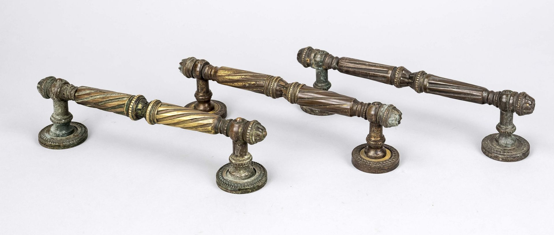 3 Door handles, late 19th century, bronze. Profiled and ornamented, fluted, w. 24 cm each.